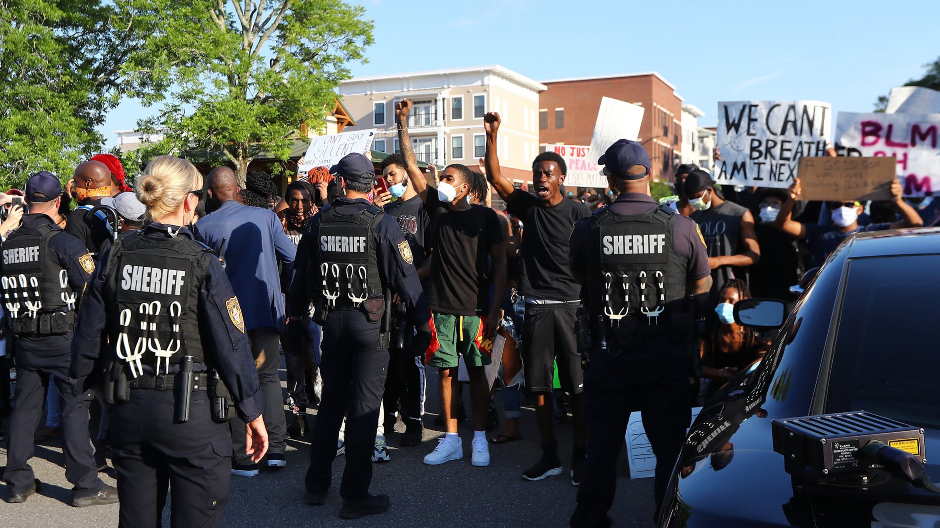 Protesters and police face off on South Clayton Street a few blocks from Lawrenceville City Hall as protests continue for a fourth day around metro Atlanta over the death of George Floyd on Monday, June 1, 2020, in Lawrenceville. Curtis Compton ccompton@ajc.com