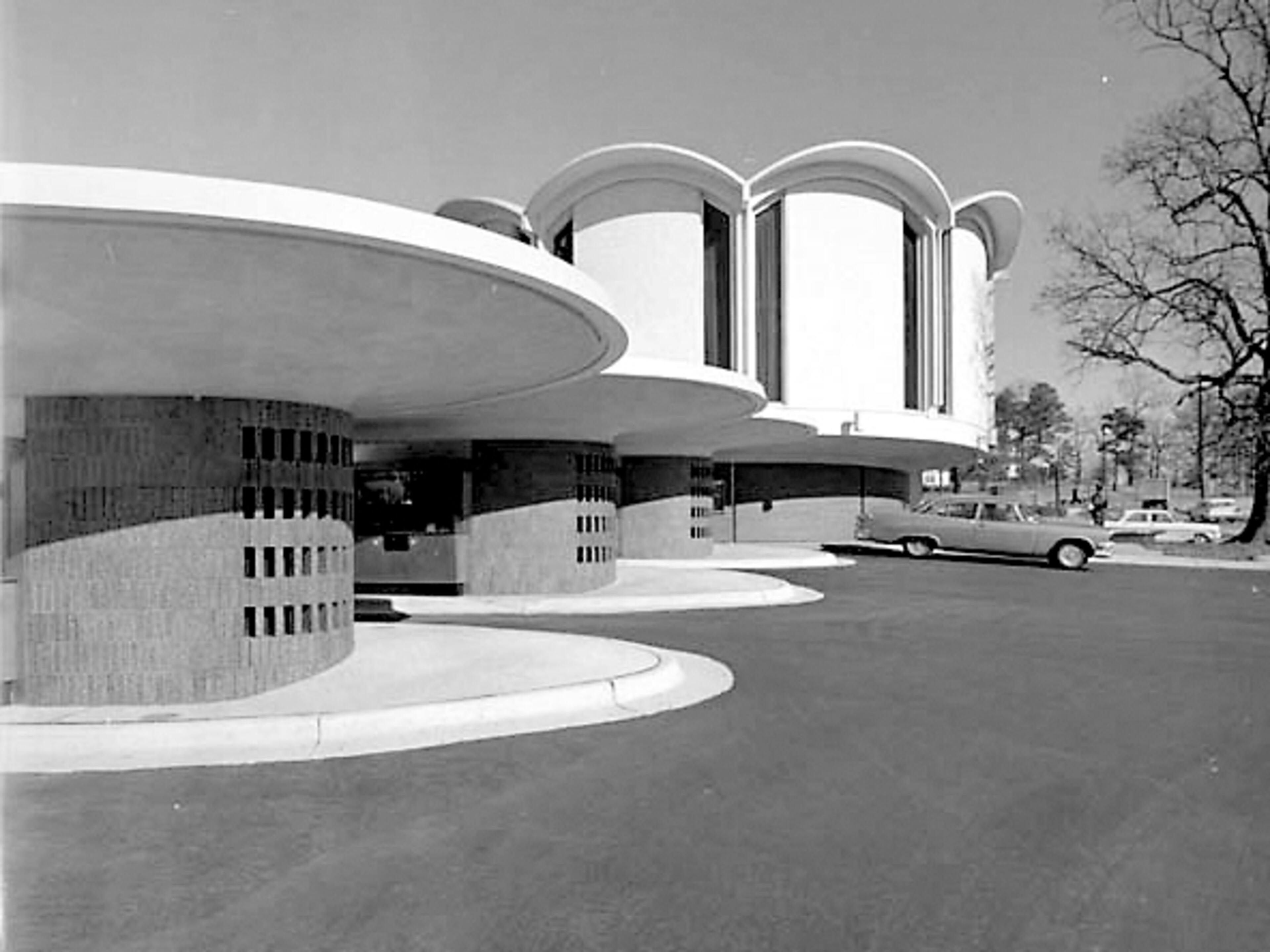 TRUST COMPANY BUILDING (2160 Monroe Drive). Significance: With an award-winning design by Atlanta architect Henri Jova, the bank branch is one of Atlanta's most acclaimed buildings from the 1960s (seen here in its heyday). It has served as a number of restaurants since a successful restoration in 2005. Since 2014, the APC had been considering moving the building to its "Formerly Endangered" list. However, in 2016 the building's owners indicated their intention to demolish the building and replace it with a 5-story self-storage facility. (Special to the AJC)
