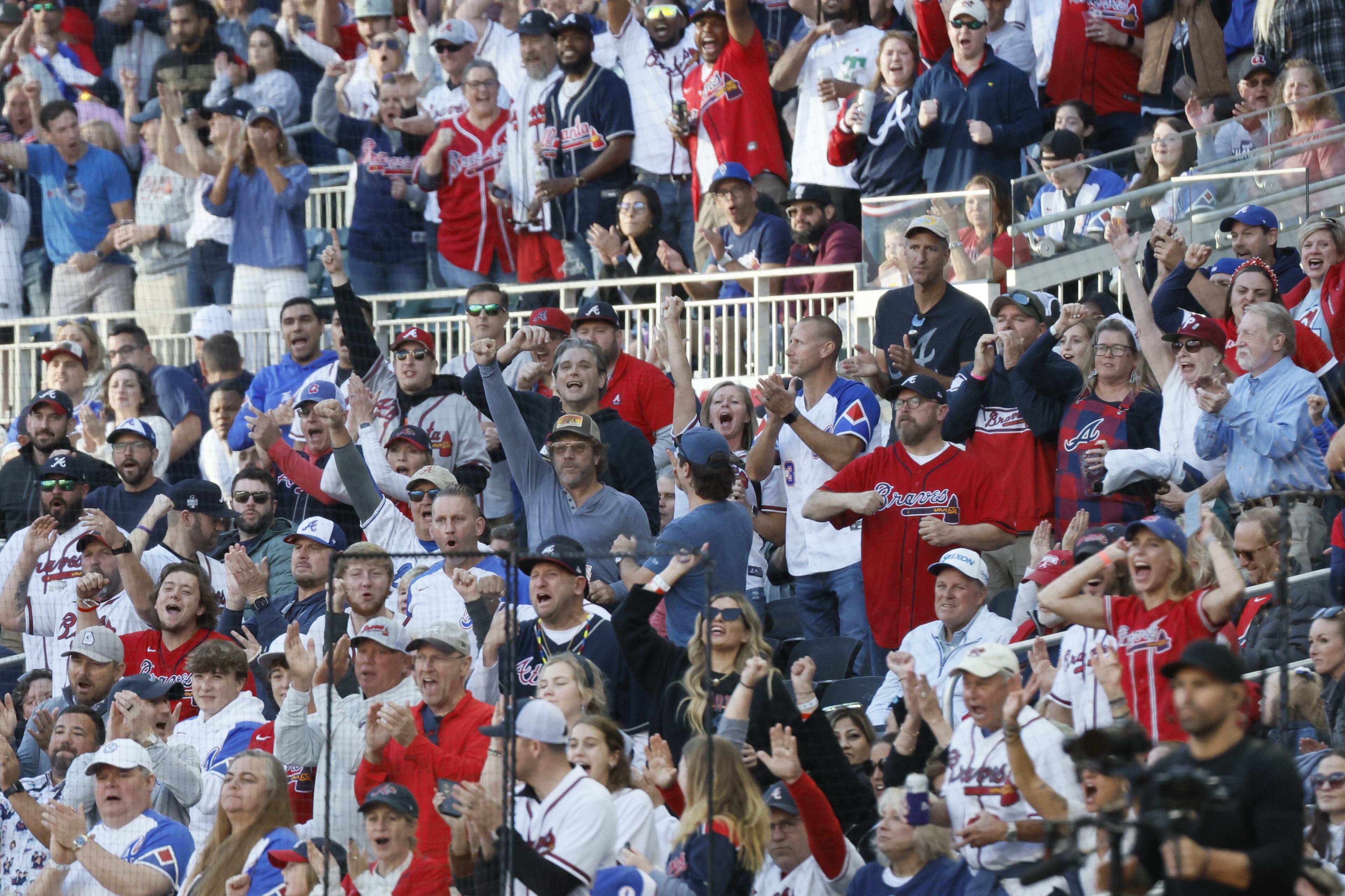 Braves fans cheer a double play in first inning during Game 1 of the NLDS at Truist Park in Atlanta. (Miguel Martinez / Miguel.Martinezjimenez@ajc.com)