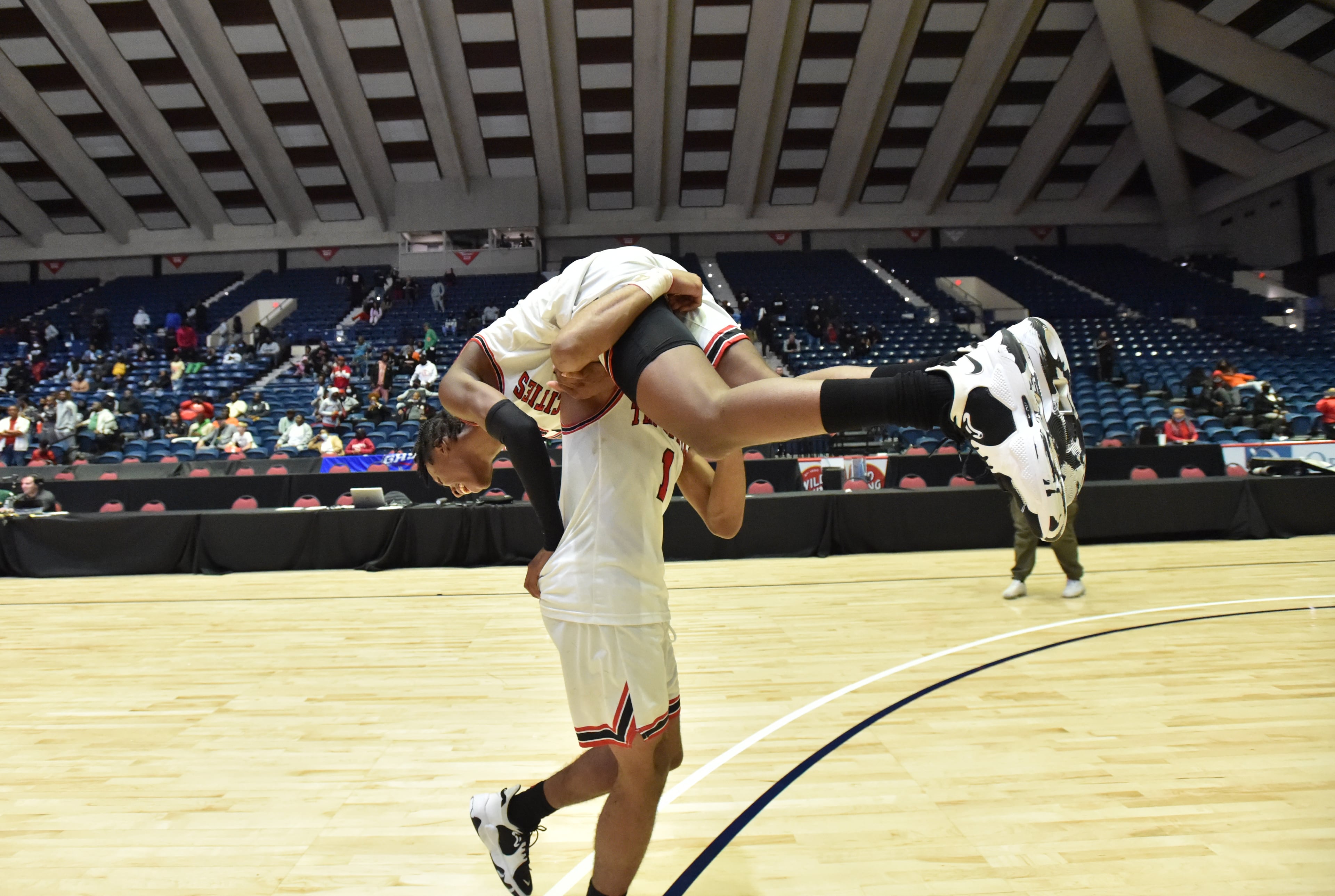 Tri-Cities' Noricco Danner (bottom) celebrates with a teammate. (Hyosub Shin / Hyosub.Shin@ajc.com)