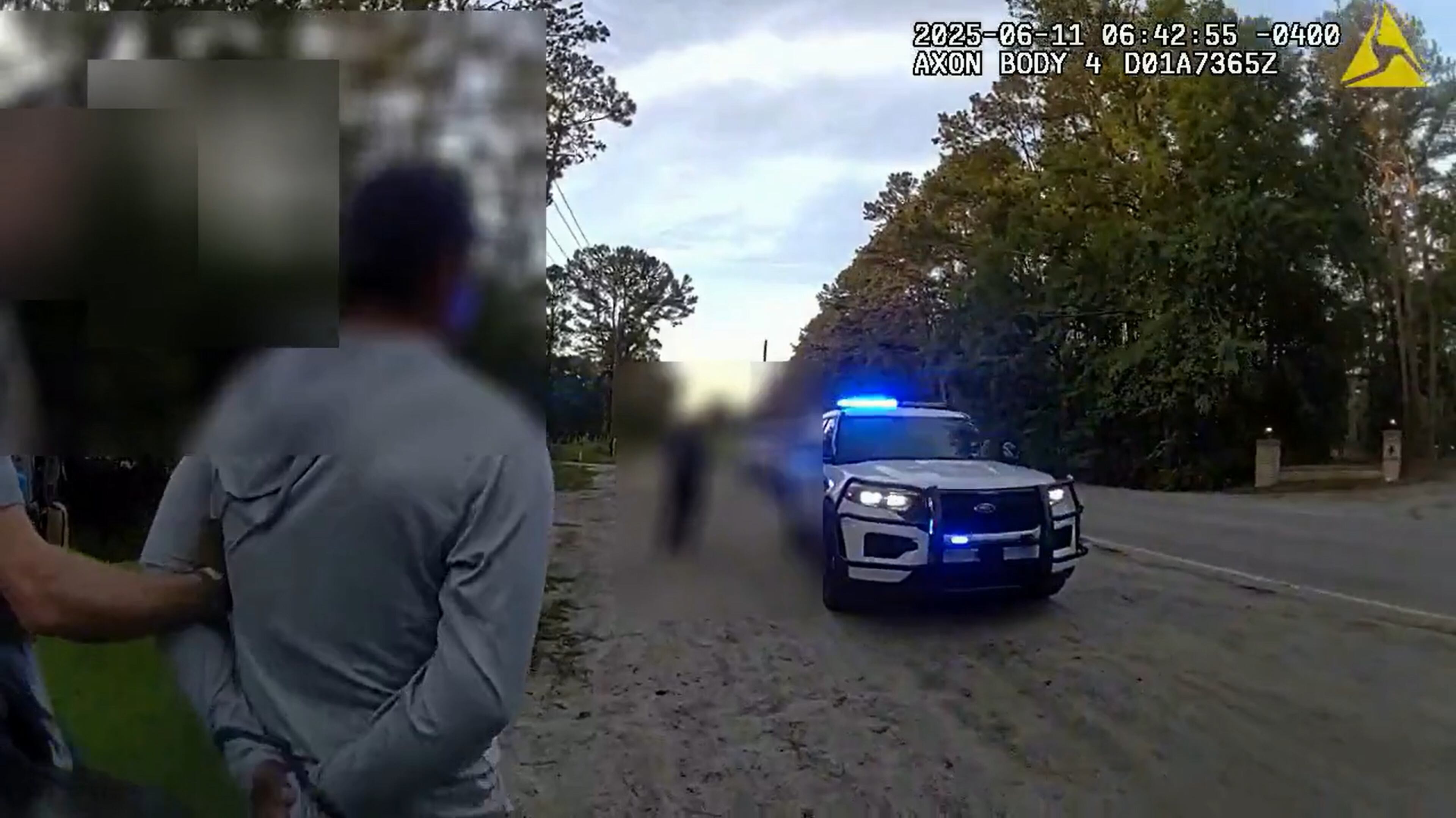 An ICE agent guides a handcuffed Mexican national to a Chatham County Police Department patrol vehicle. (Courtesy of Chatham County Police Department)