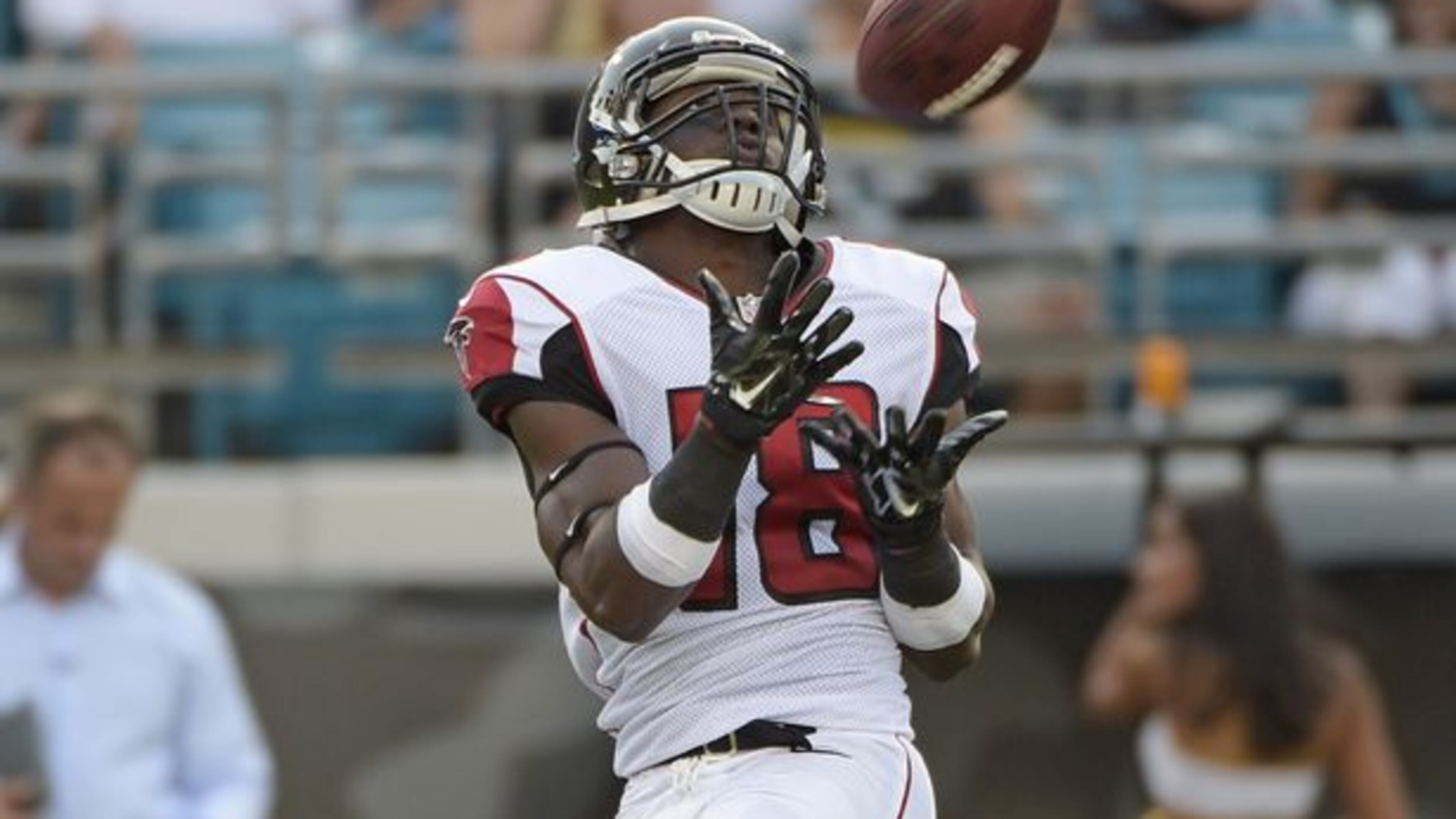 Atlanta Falcons wide receiver Freddie Martino (18) catches a pass for a 67-yard touchdown against the Jacksonville Jaguars during the first half of an NFL preseason football game in Jacksonville, Fla., Thursday, Aug. 28, 2014. (AP Photo/Phelan M. Ebenhack)