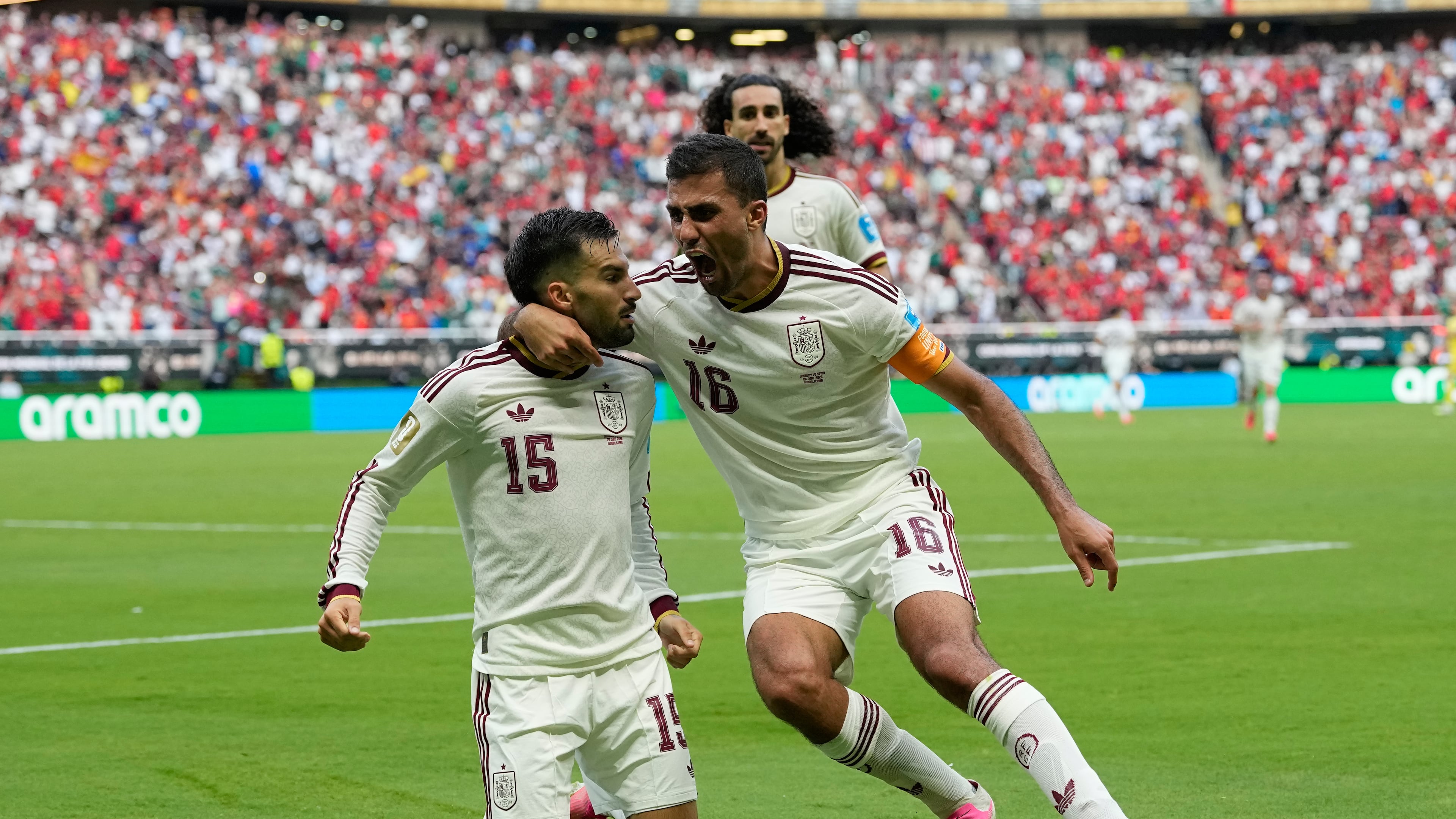 Spain's Alex Baena, left, is congratulated after scoring his side's opening goal by Rodri during the World Cup Group H soccer match between Uruguay and Spain in Zapopan, near Guadalajara, Mexico, Friday, June 26, 2026. (AP Photo/Natacha Pisarenko)