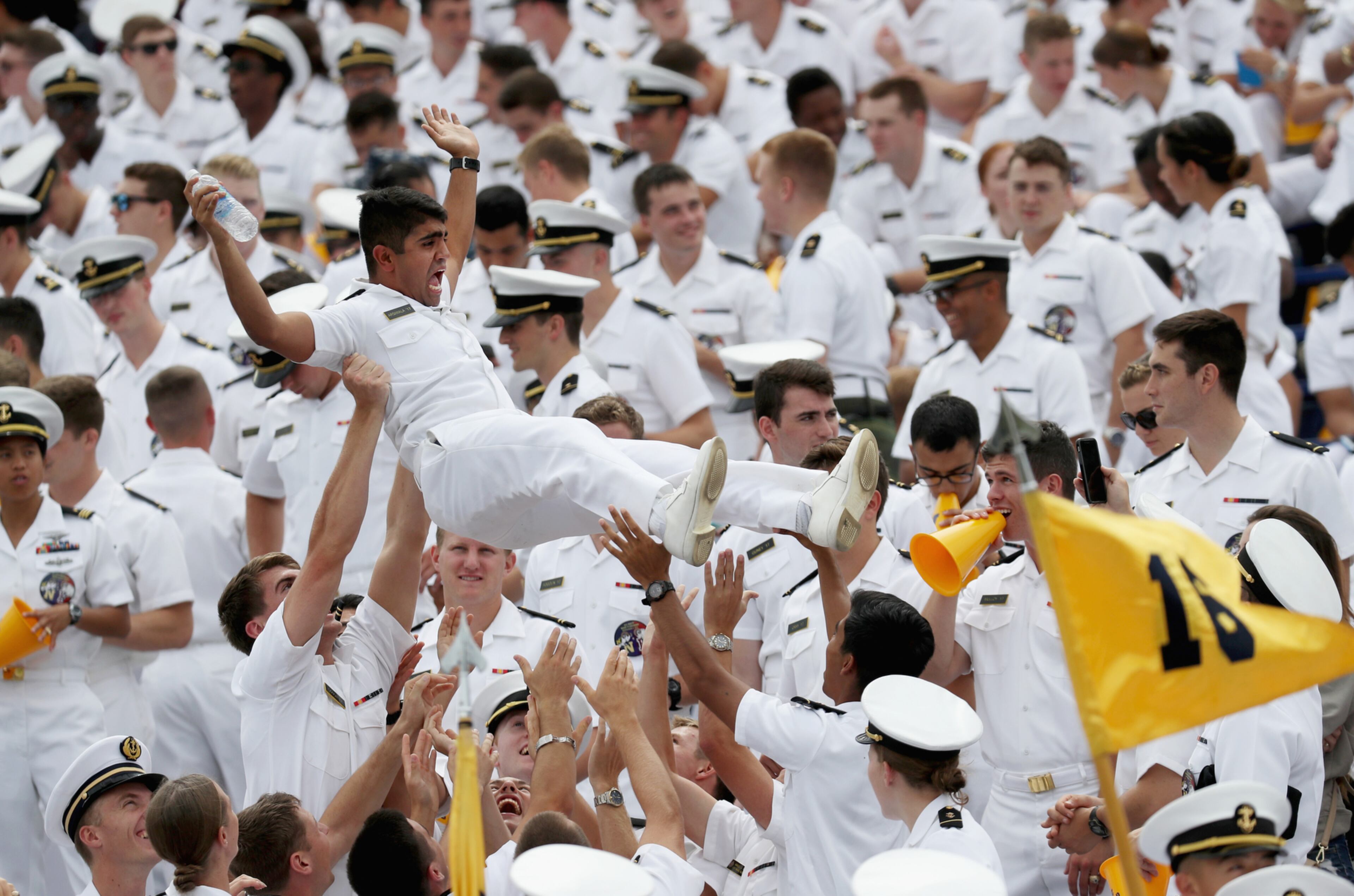 ANNAPOLIS, MD - SEPTEMBER 03: A Navy Midshipmen is tossed in the air after Navy scored a second quarter touchdown against the Fordham Rams at Navy-Marine Corps Memorial Stadium on September 3, 2016 in Annapolis, Maryland. (Photo by Rob Carr/Getty Images) *** BESTPIX ***