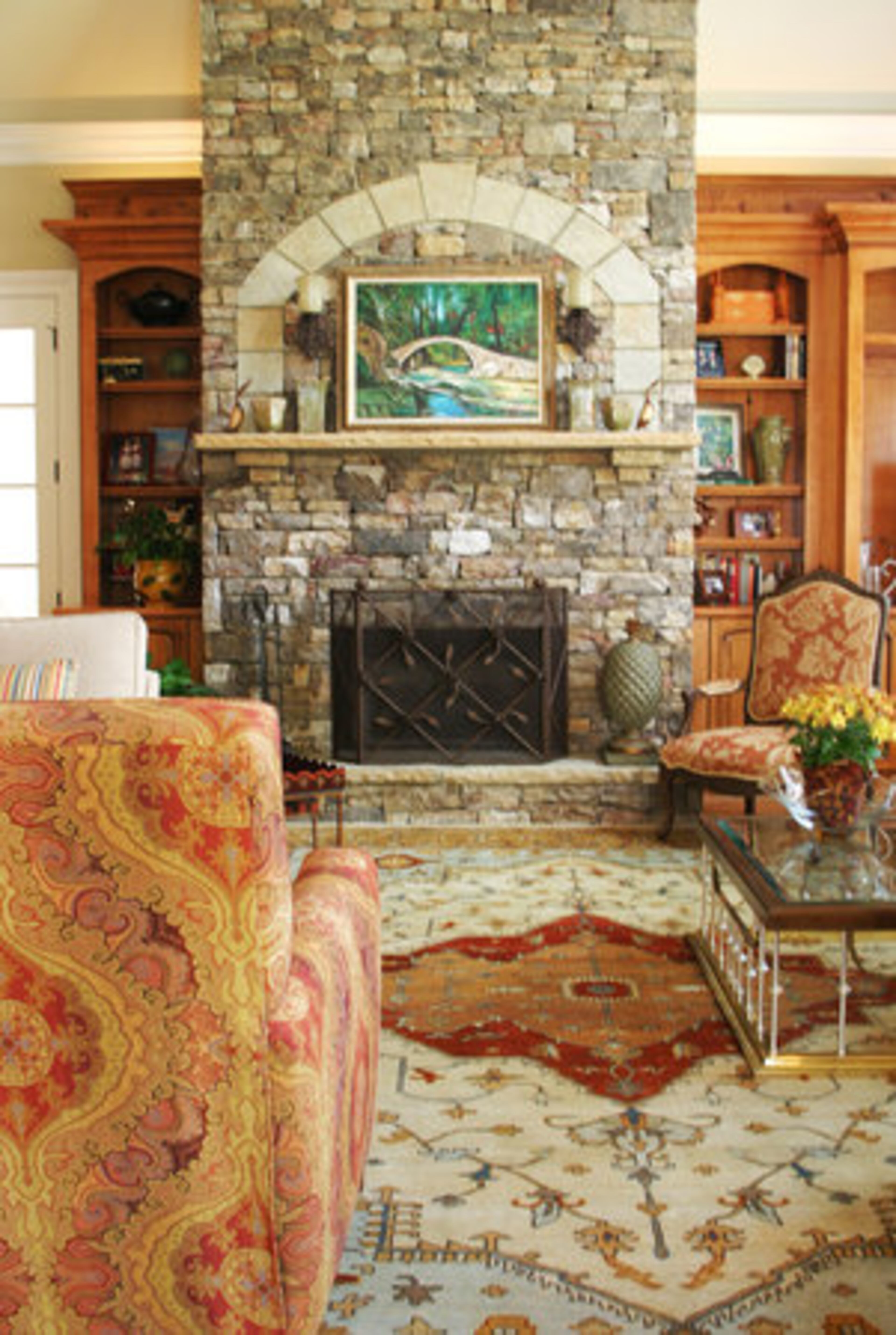 The keeping room opens to the kitchen, has vaulted ceilings and one of the six fireplaces in the home.