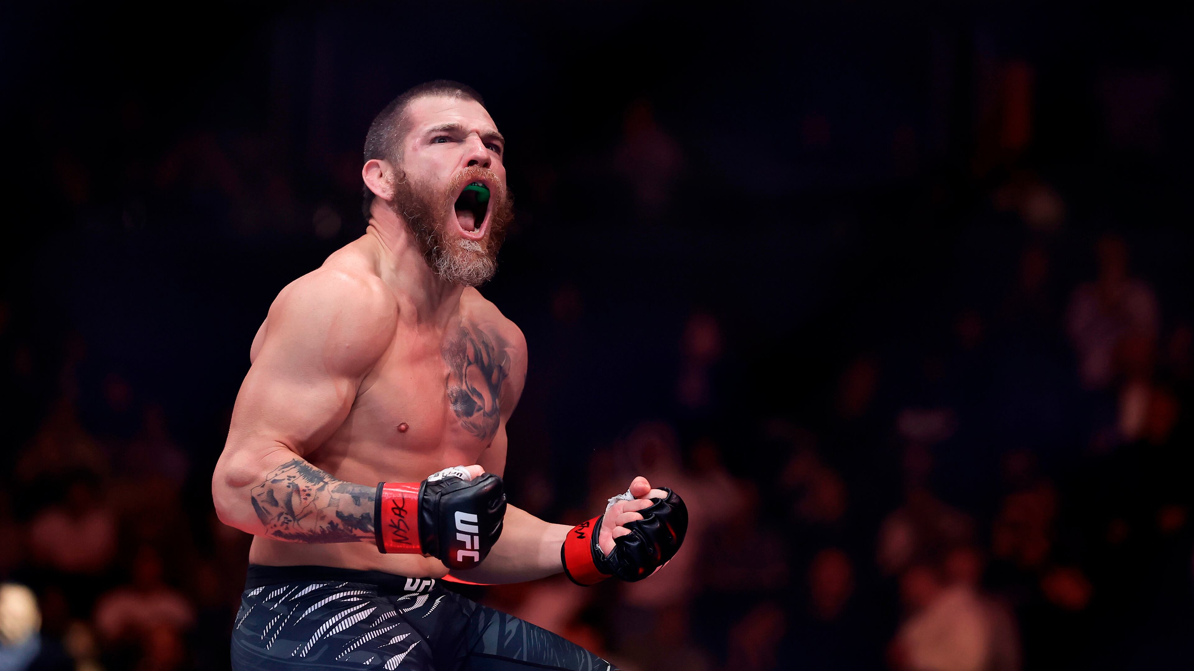 FILE - Jim Miller reacts after defeating Damon Jackson in a UFC 309 mixed martial arts lightweight title bout, Nov. 16, 2024, in New York. (AP Photo/Adam Hunger, File)