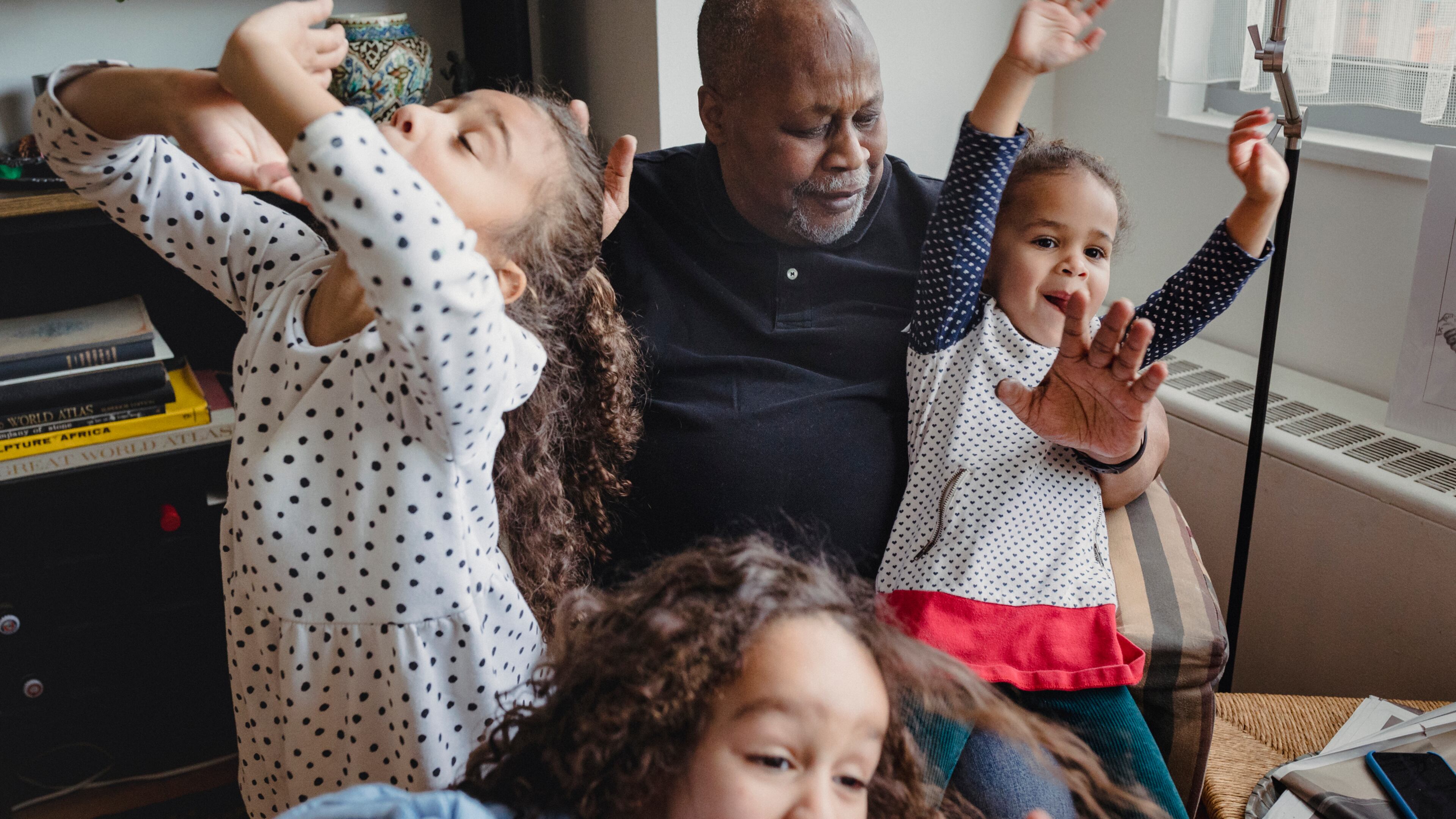 Barry Sage-El, 69, who describes himself as the master of the sleepover, with his three granddaughters at his home in Montclair, N.J. Men have been creating new norms for grandparenting with help from a growing body of resources, including the Atlanta-based podcast, the Cool Grandpa, launched five years ago by Cumming resident Greg Payne. (Sara Naomi Lewkowicz/The New York Times)