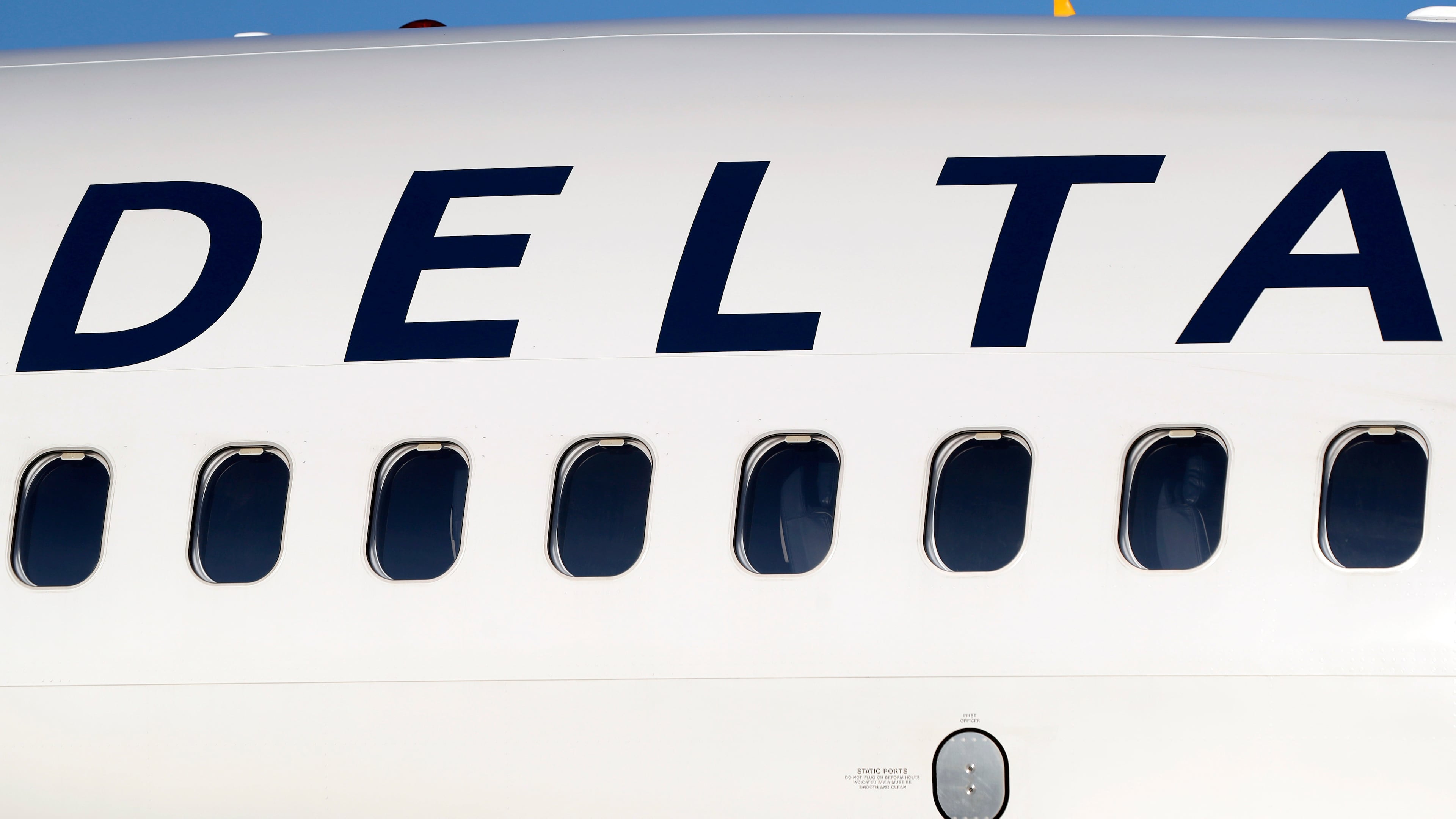FILE - In this June 26, 2019, file photo, the company logo graces the side of a Delta Air Lines jetliner at Denver International Airport in Denver. (AP Photo/David Zalubowski, File)
