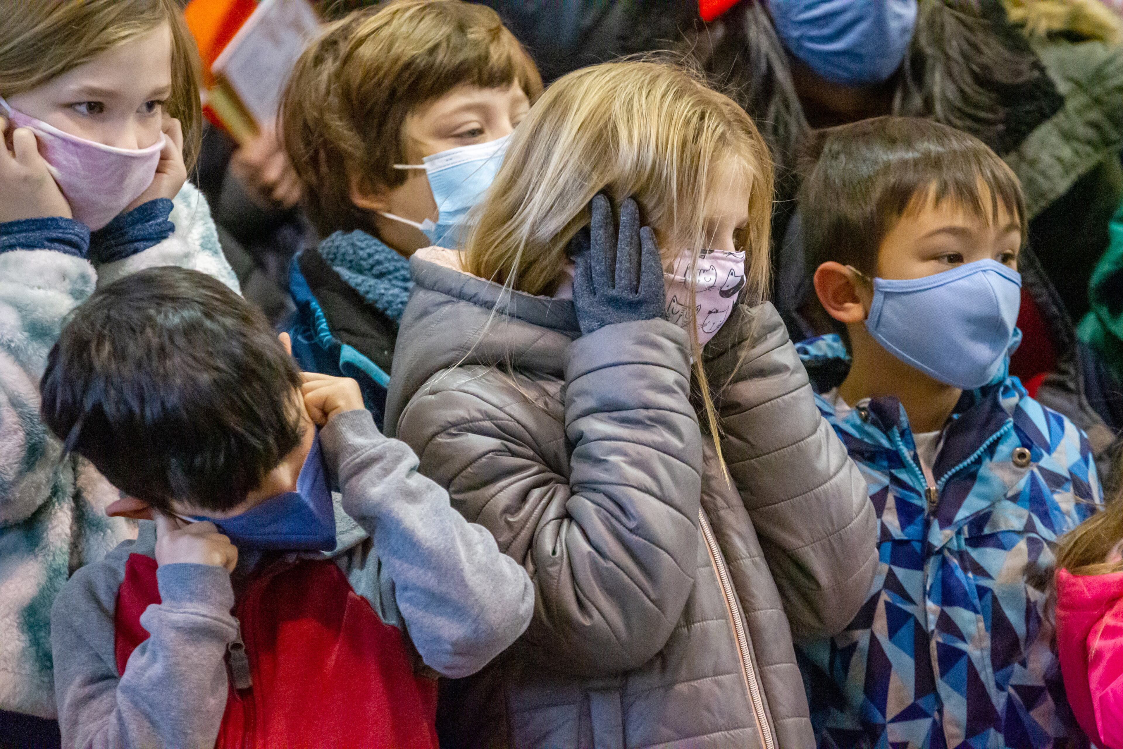 The loud beating of drums causes children to cover their ears as they watch the Lion Dance during Decatur's first Lunar New Year celebration at Legacy Park on Saturday, January 29, 2022. STEVE SCHAEFER FOR THE ATLANTA JOURNAL-CONSTITUTION