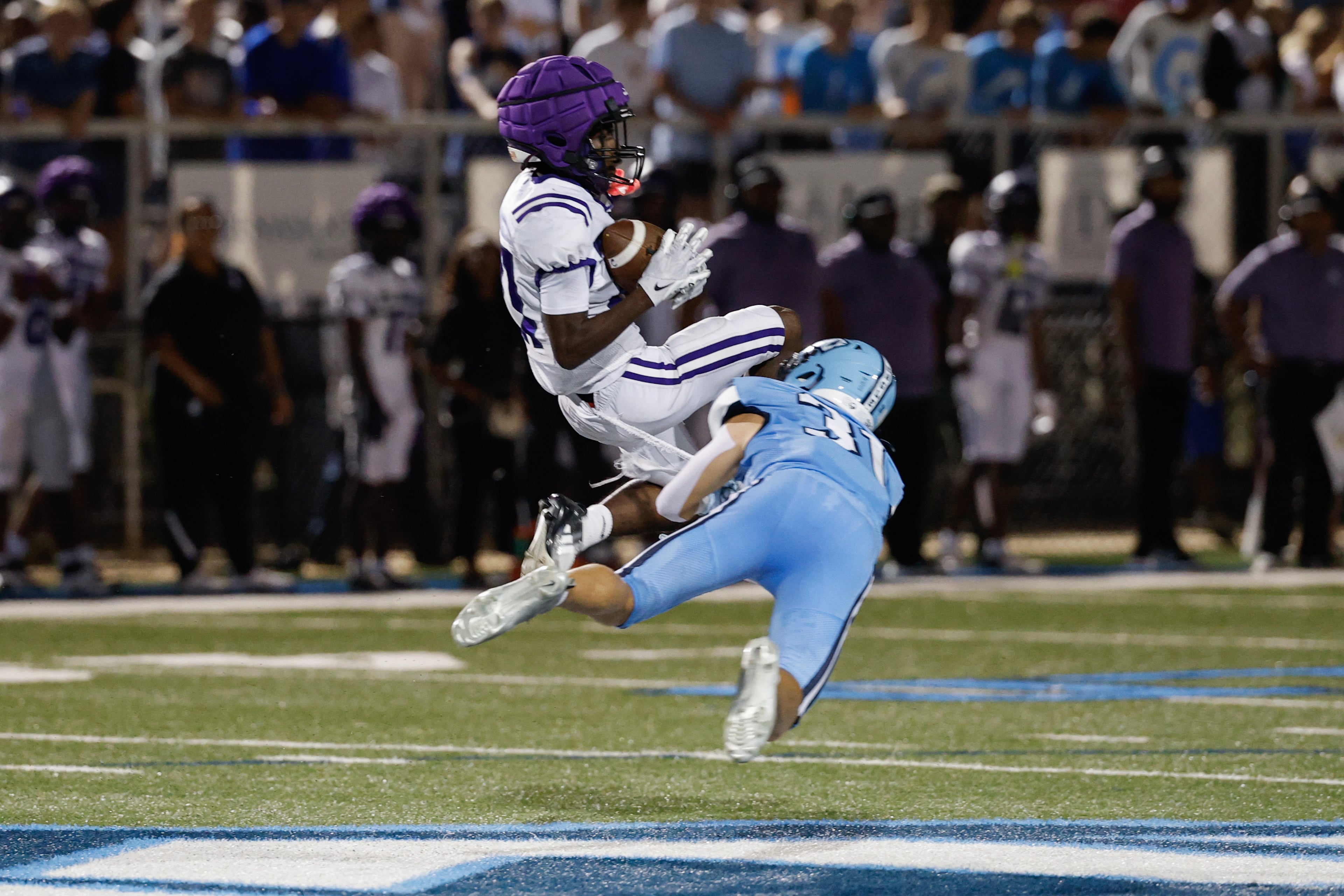 KIPP Atlanta’s Jaire Stridiron (left) makes a pass reception against North Cobb Christian’s Bryson Vickery on Friday, Oct. 2, 2026, in Kennesaw. (Erik S. Lesser for the AJC)