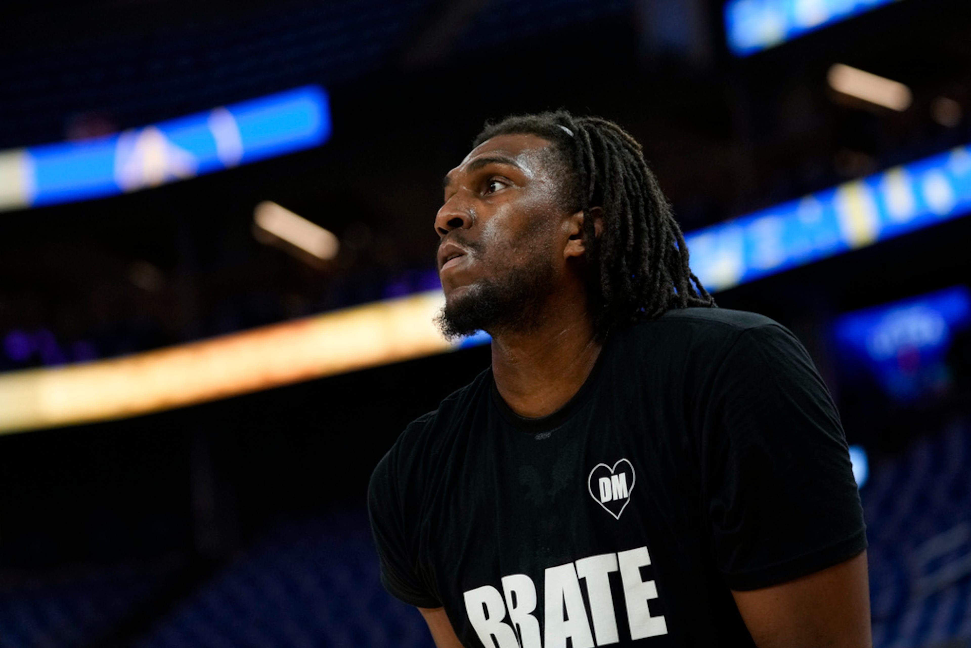 Golden State Warriors center Kevon Looney warms up before the team's NBA basketball game against the Atlanta Hawks, Wednesday, Jan. 24, 2024, in San Francisco. (AP Photo/Godofredo A. Vásquez)