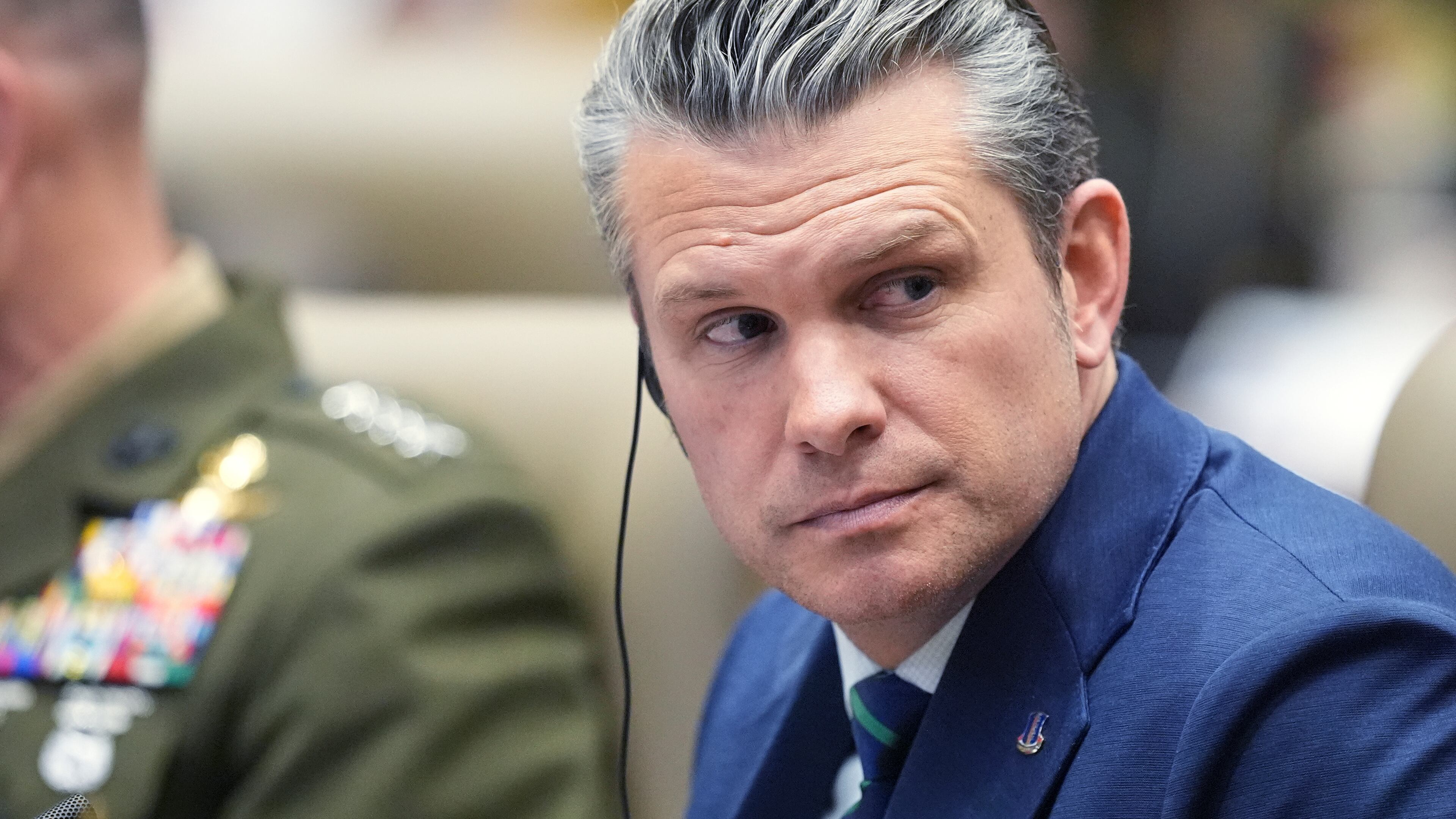 Defense Secretary Pete Hegseth listens during the inaugural Americas Counter Cartel Conference at U.S. Southern Command in Doral, Fla., Thursday, March 5, 2026. (AP Photo/Rebecca Blackwell)