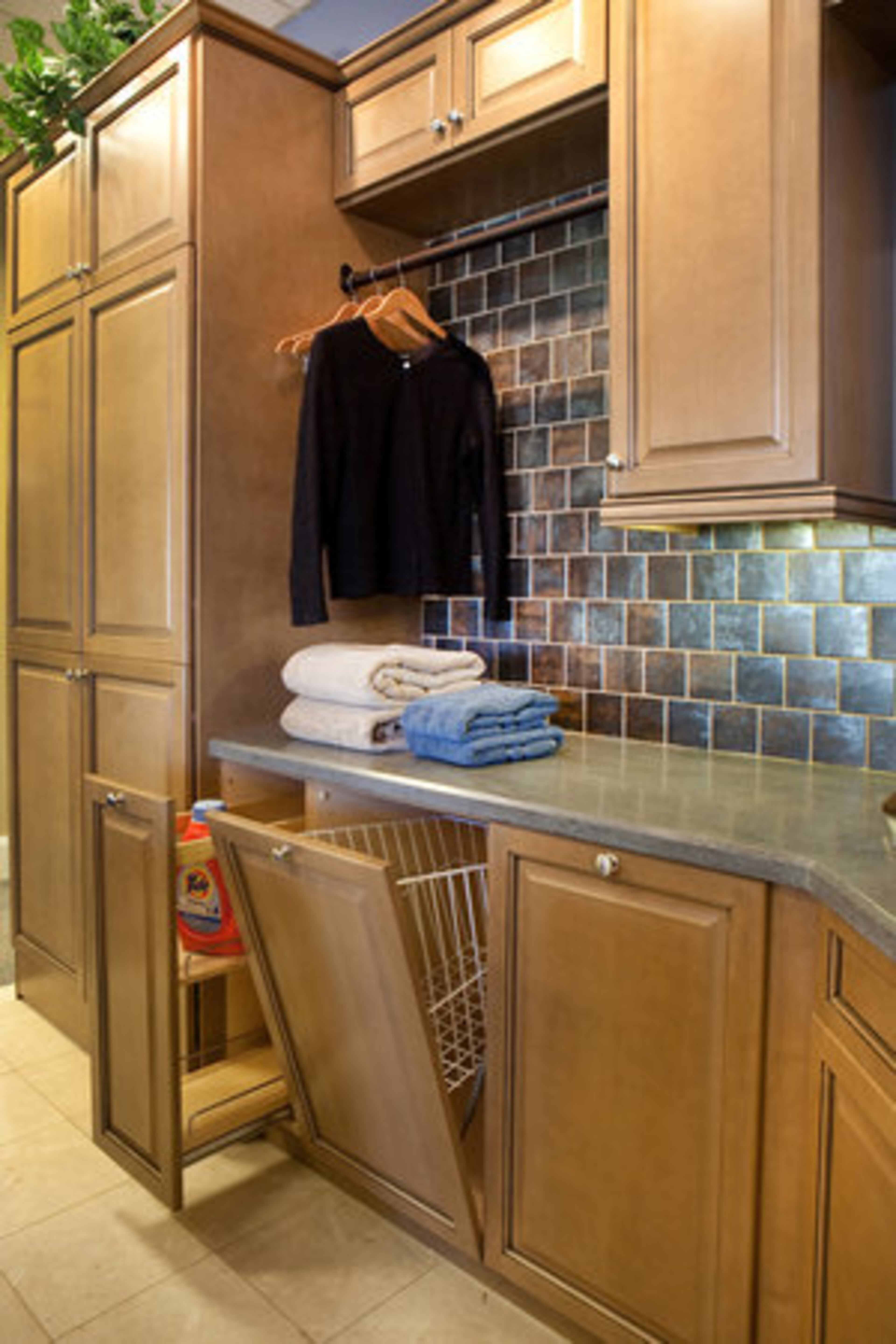 Custom cabinetry that hides away the mess of the typical laundry room's dirty work is key. Area contractors price laundry room renovations at anywhere from $2,000-$10,000, depending upon the size of the room and the complexity of the project.