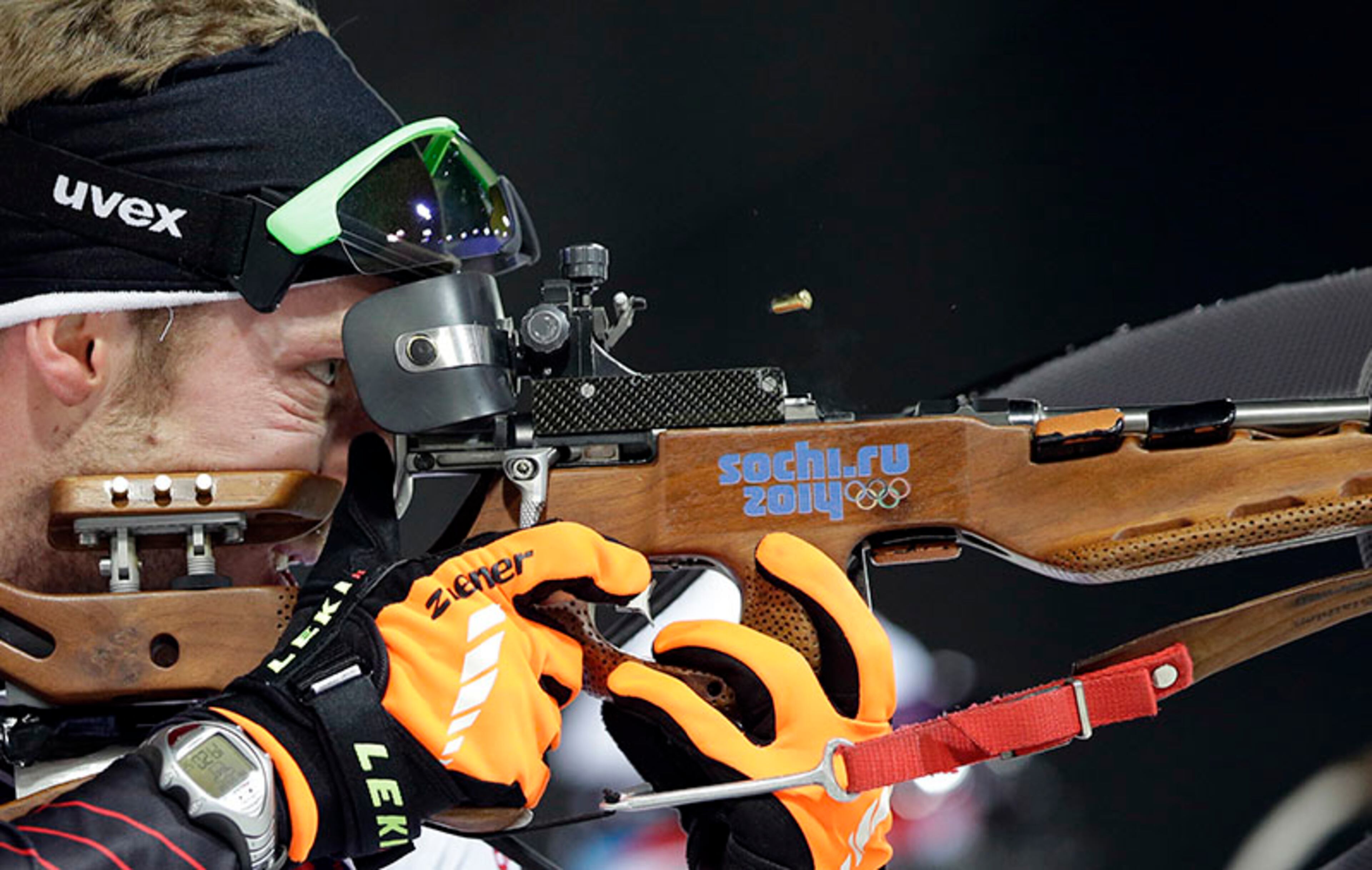 Austria's Dominik Landertinger shoots during the men's biathlon 12.5k pursuit, at the 2014 Winter Olympics, Monday, Feb. 10, 2014, in Krasnaya Polyana, Russia.
