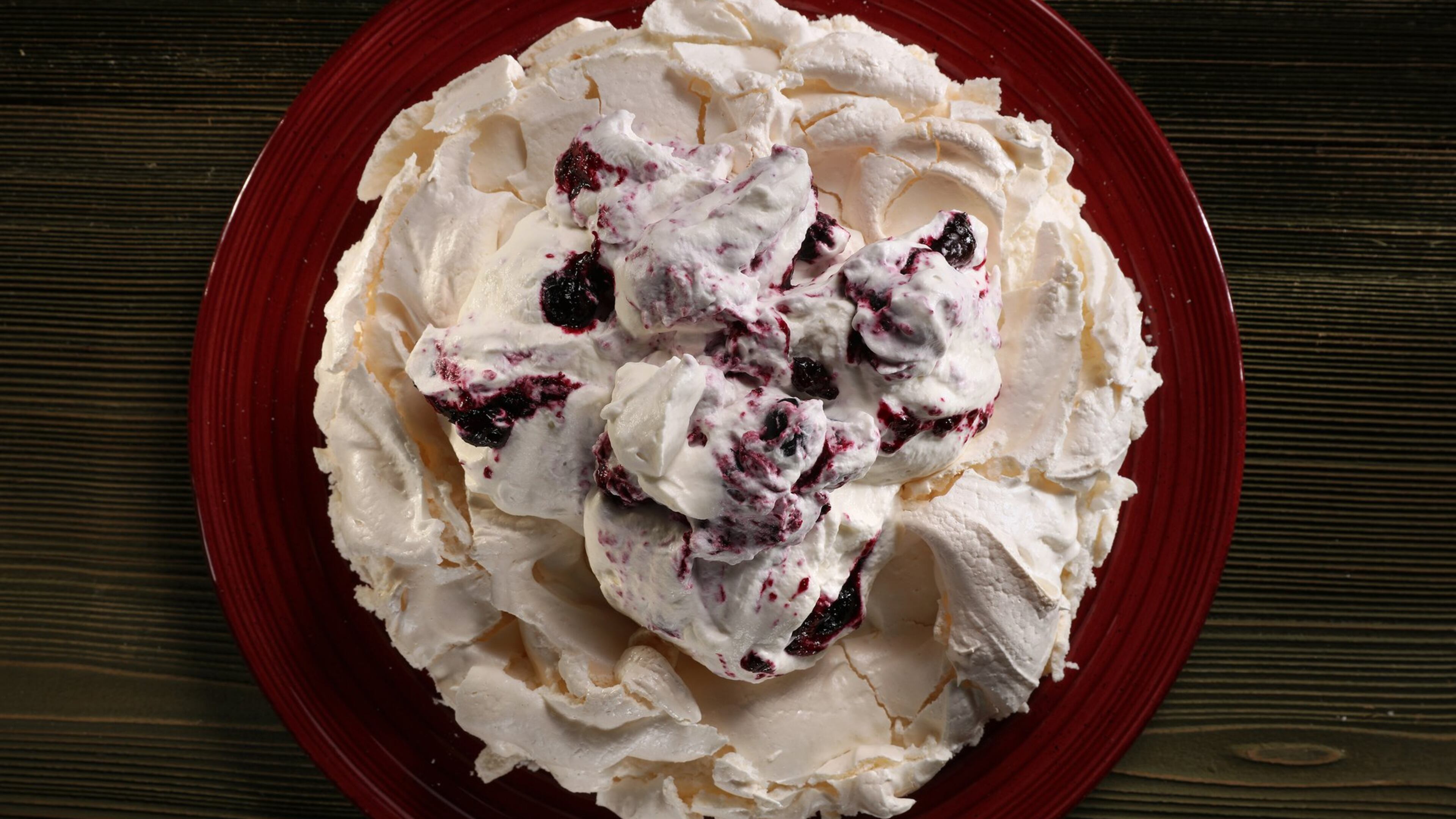 Whipped cream, roiled dark with blueberry mash, makes for a dramatic dessert, one worthy of its stunning namesake, asperitas clouds. (Abel Uribe/Chicago Tribune/TNS)
