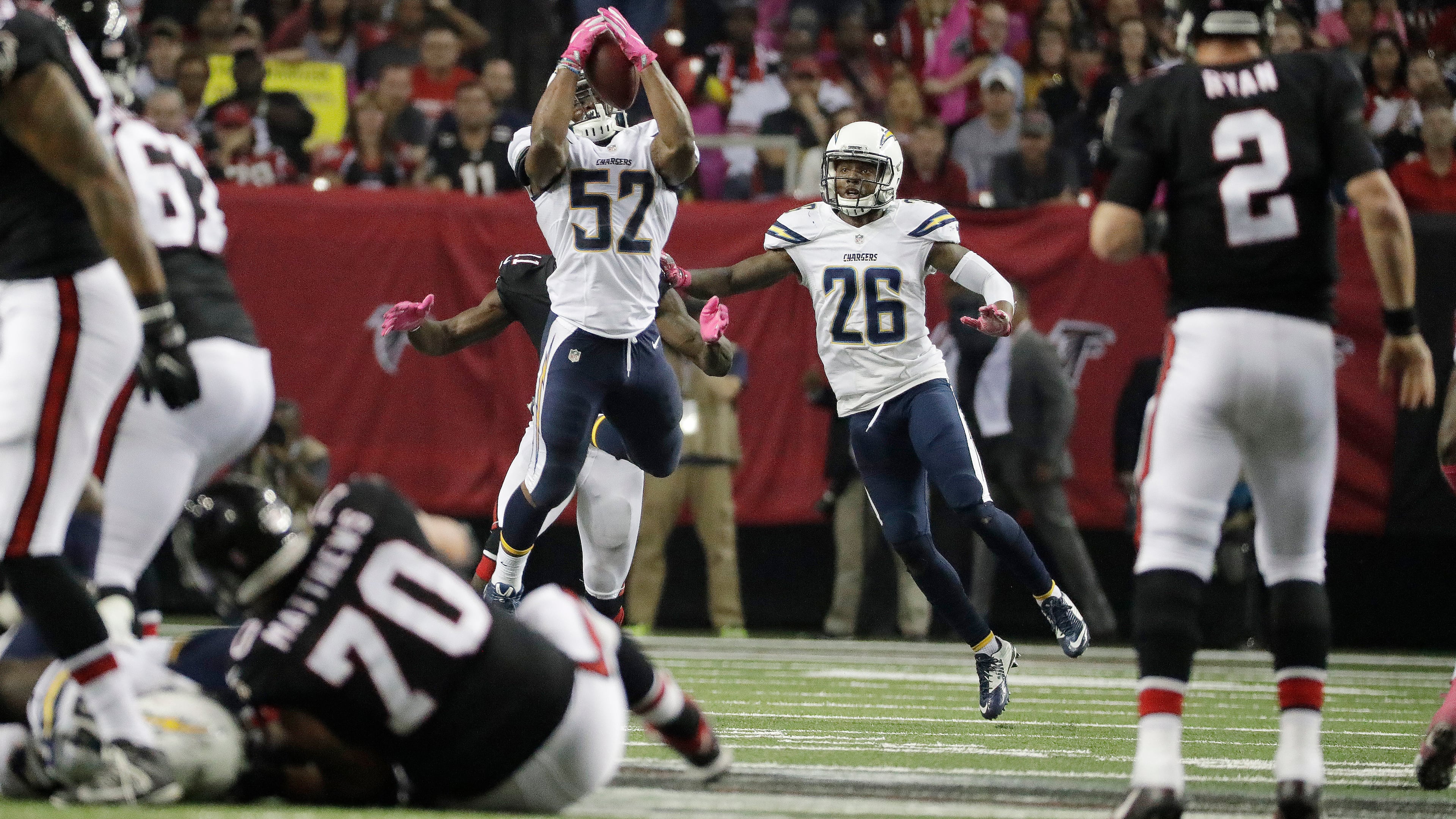 Atlanta Falcons quarterback Matt Ryan (2) throws an interception to San Diego Chargers inside linebacker Denzel Perryman (52) during the second half of an NFL football game, Sunday, Oct. 23, 2016, in Atlanta. (AP Photo/David Goldman)