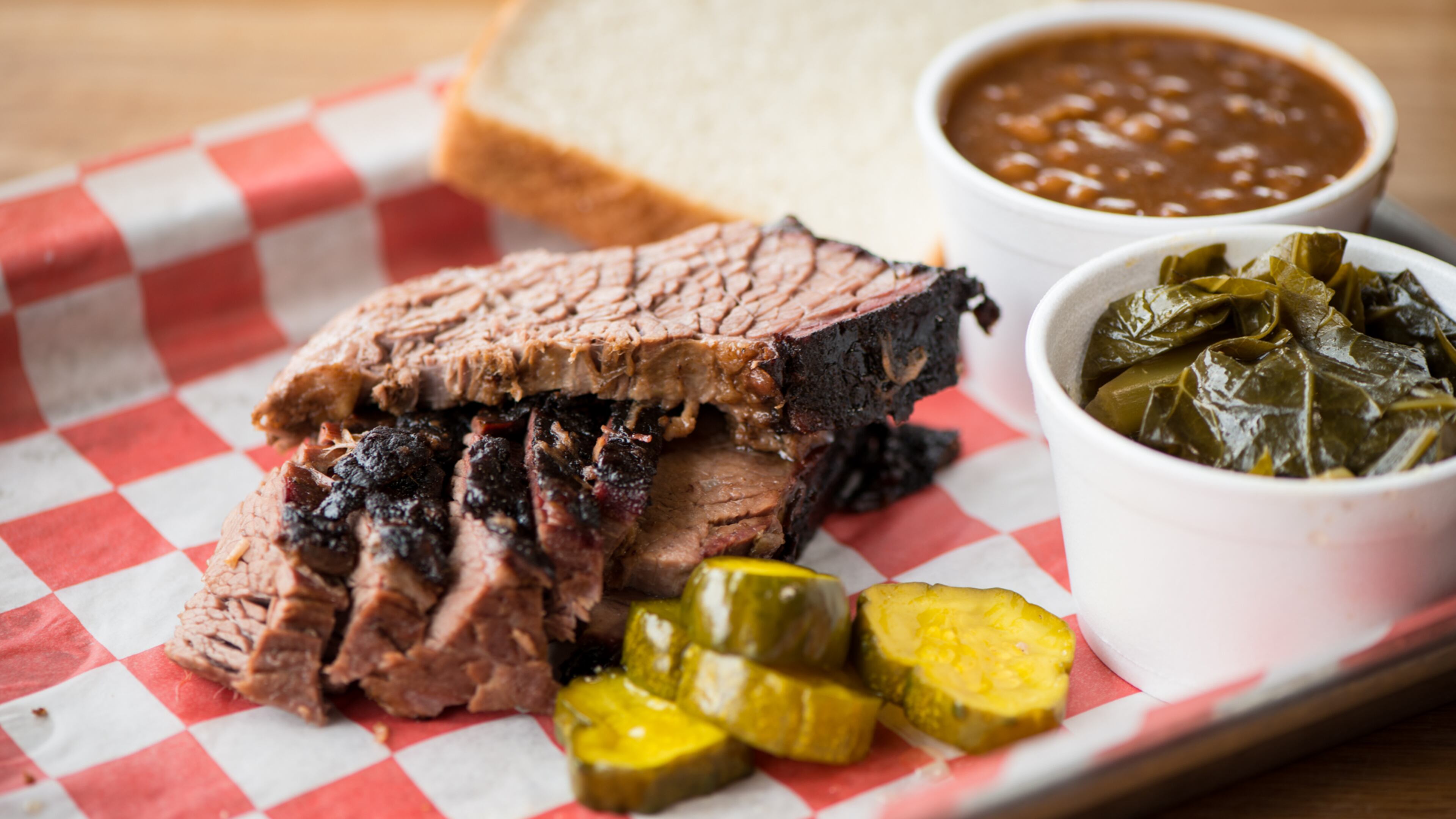 King Barbecue Sliced Brisket Meat Plate with collard greens, beans, and pickles. Photo credit- Mia Yakel.