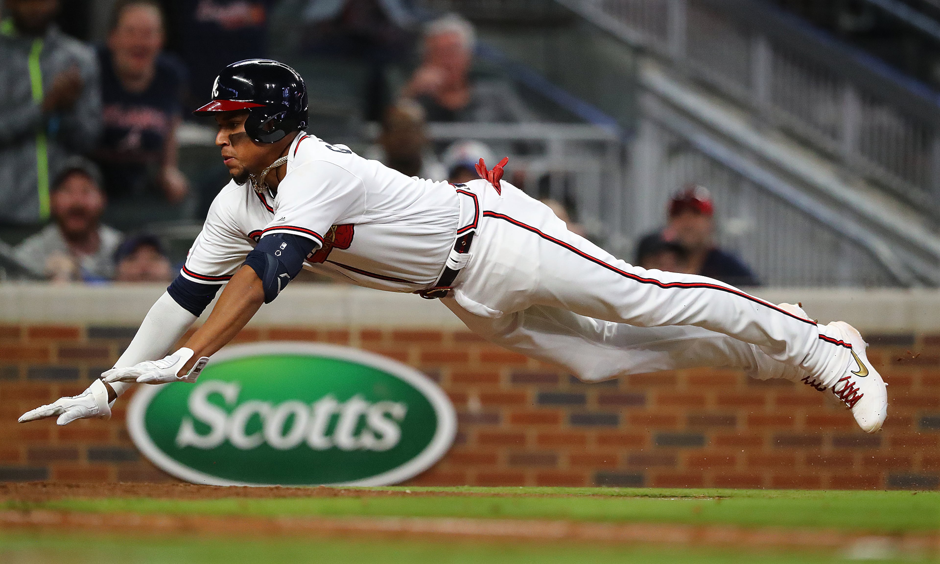 Johan Camargo scores on a sacrifice fly by Dansby Swanson to take a 6-4 lead. Curtis Compton/ccompton@ajc.com