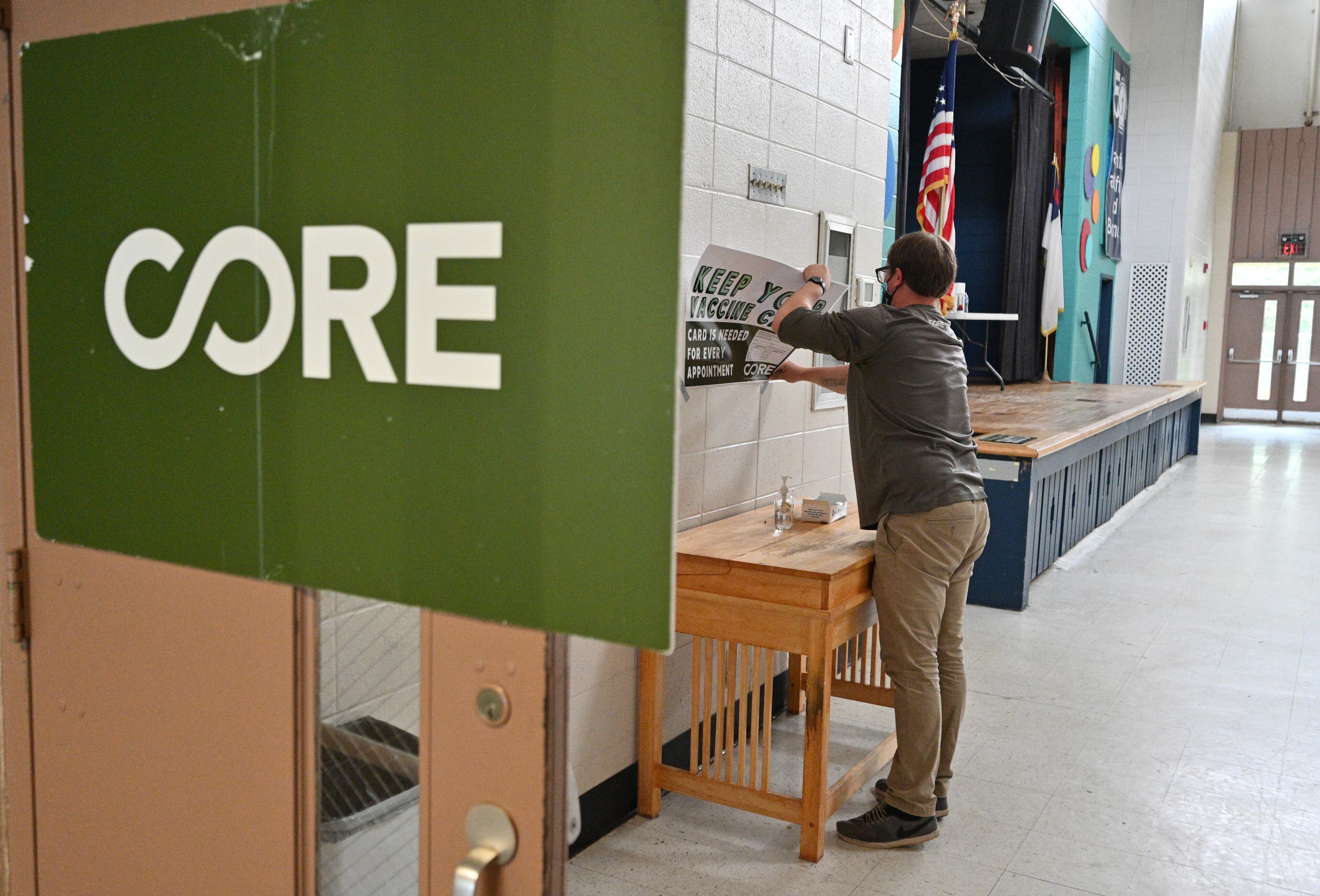 Riley Erickson, site manager with CORE, packs up after waiting for the last scheduled client showing up at North Springs United Methodist Church in Sandy Springs on July 8, 2021. The scheduled client ended up not show up. There was only one person got vaccinated at this COREÕs free mobile COVID-19 Vaccine site, according to the site manager Riley Erickson. (Hyosub Shin / Hyosub.Shin@ajc.com)