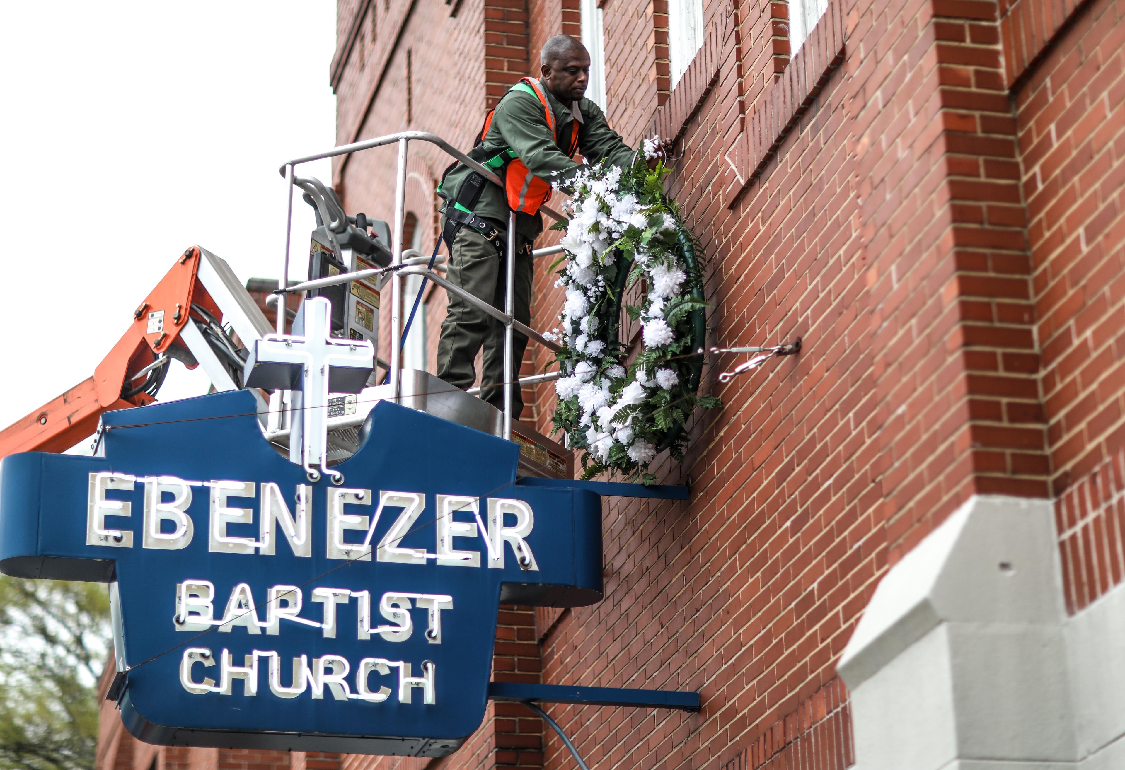 A worker hangs a wreath at Historic Ebenezer Baptist Church on Thursday, April 4, 2019. King was assassinated at the Lorraine Hotel in Memphis 51 years ago today. BRANDEN CAMP/SPECIAL
