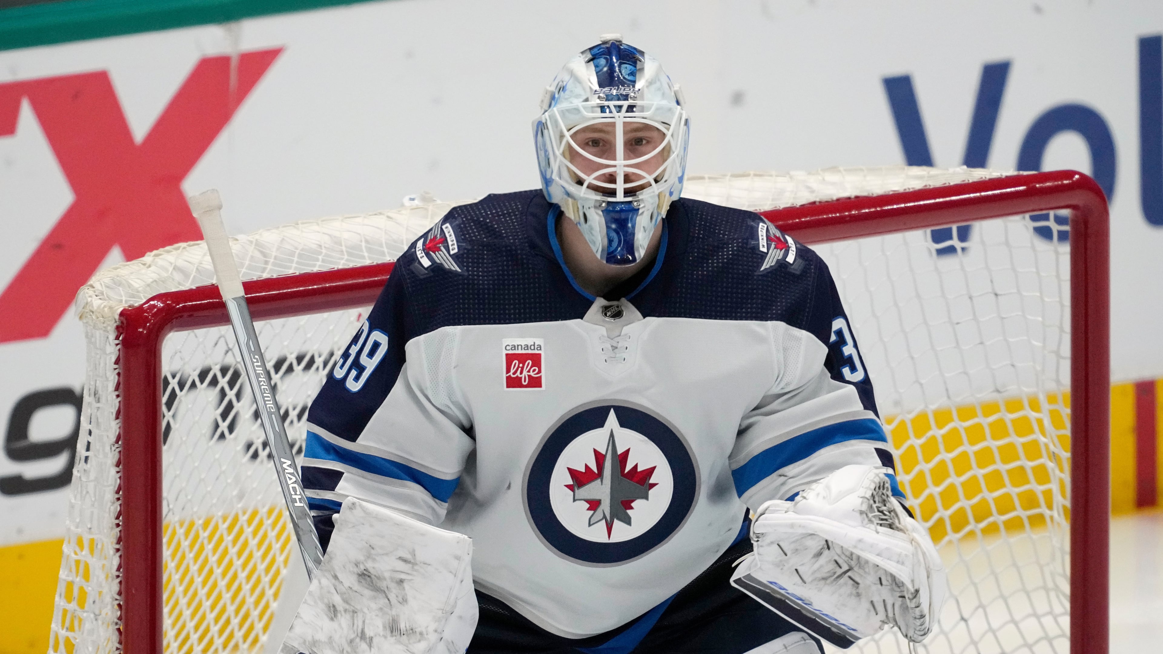 FILE - Winnipeg Jets goaltender Laurent Brossoit minds the net during an NHL hockey game against the Dallas Stars in Dallas, April 11, 2024. (AP Photo/Tony Gutierrez, File)