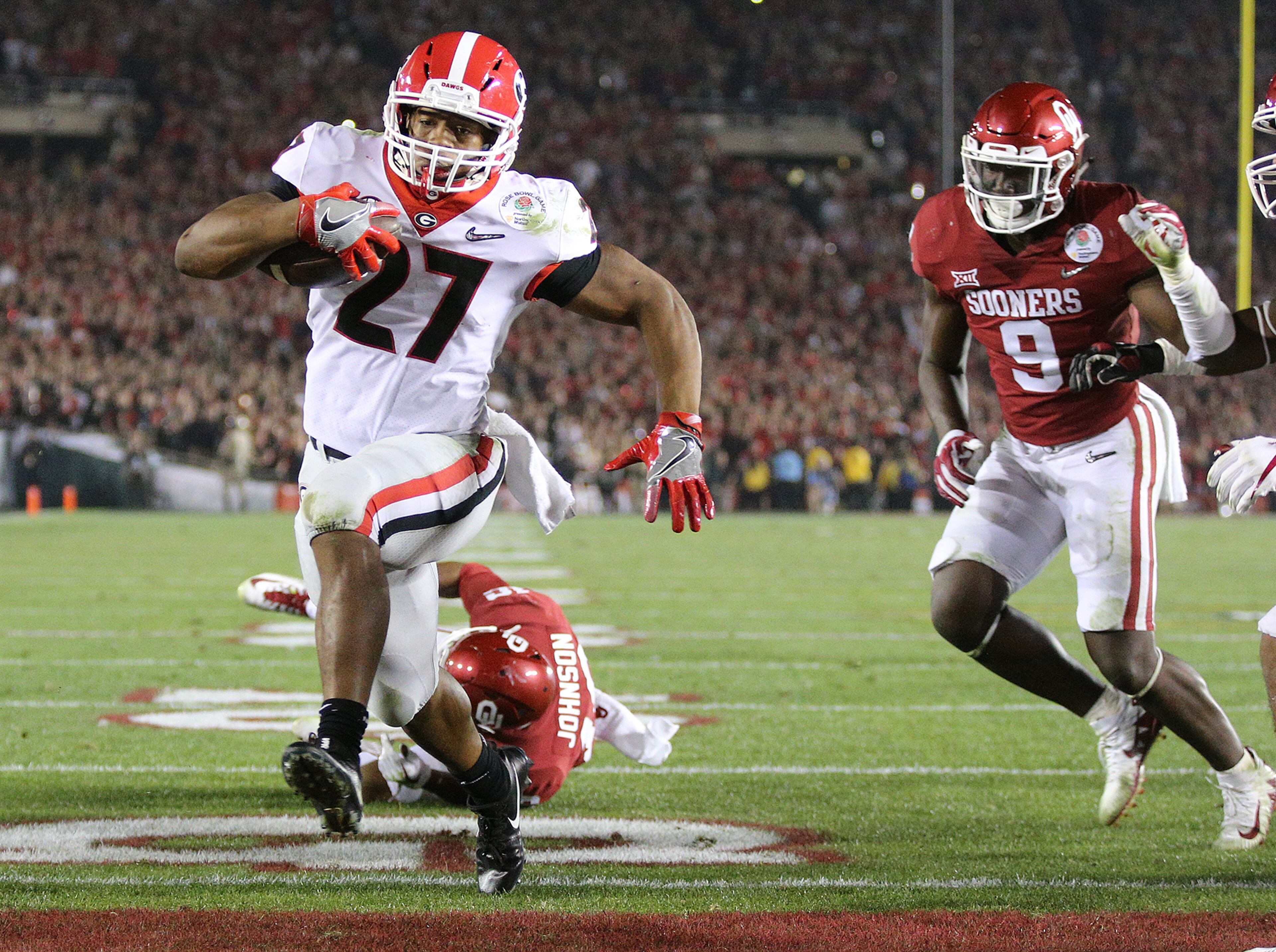 January 1, 2018 Pasadena: Georgia tailback Nick Chubb scores a touchdown to tie the game 45-45 during the fourth quarter to send it to over time in the College Football Playoff Semifinal at the Rose Bowl Game on Monday, January 1, 2018, in Pasadena. Georgia went on to beat Oklahoma 54-48 in double over time. Curtis Compton/ccompton@ajc.com