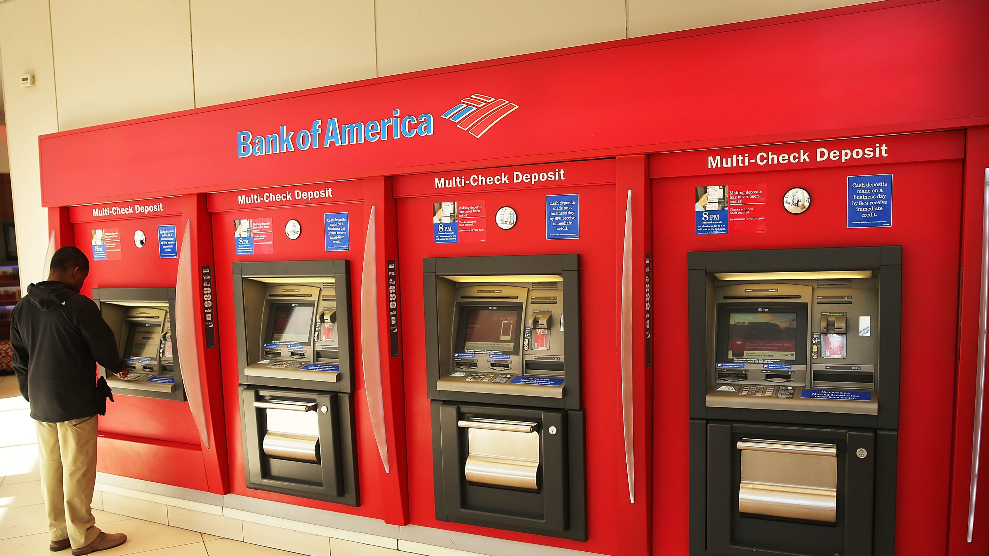 NEW YORK, NY - APRIL 16: A man uses an ATM at a Bank of America branch on April 16, 2014 in New York City. (Photo by Spencer Platt/Getty Images)
