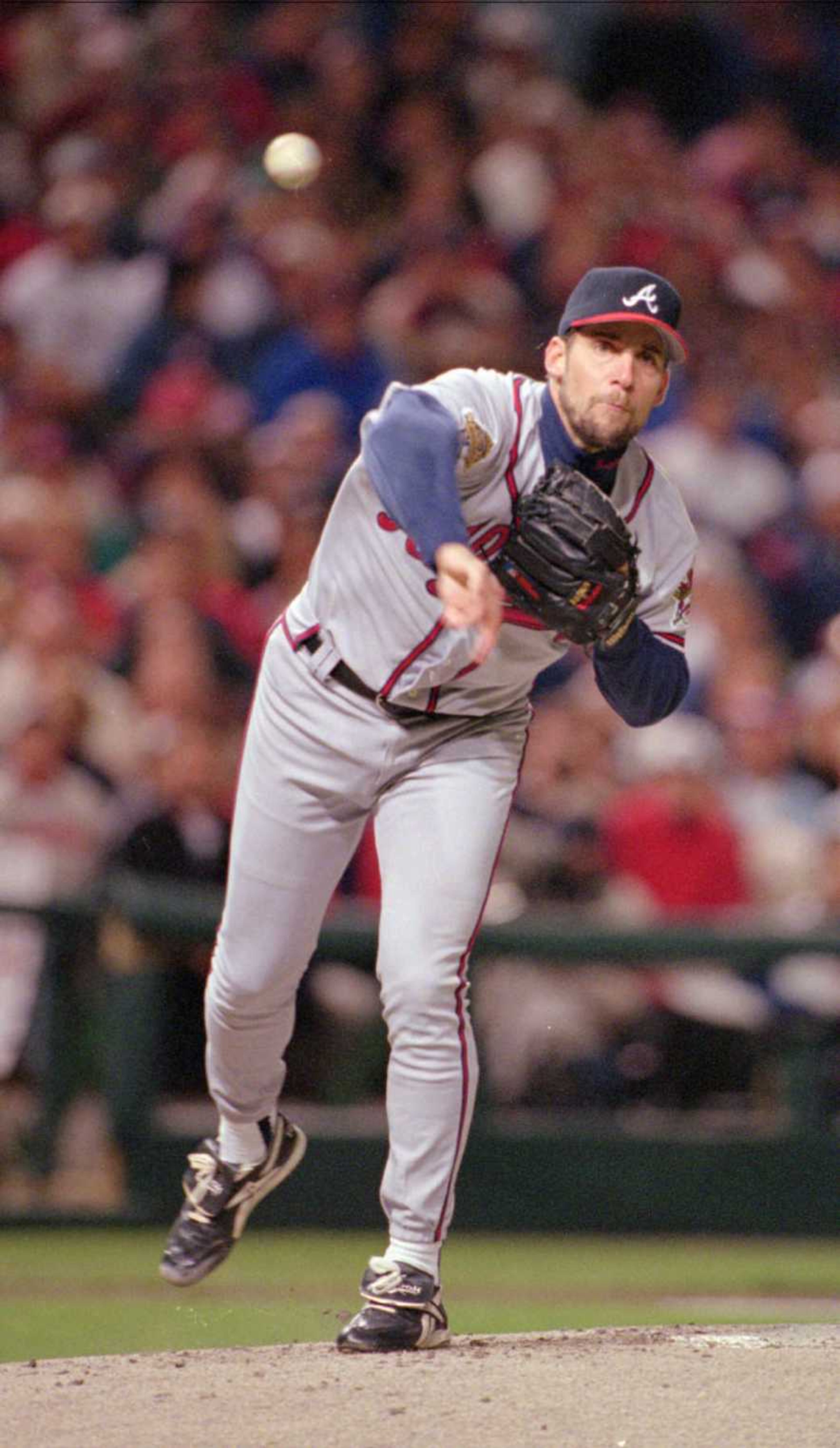 John Smoltz throws in the first inning in Cleveland.
