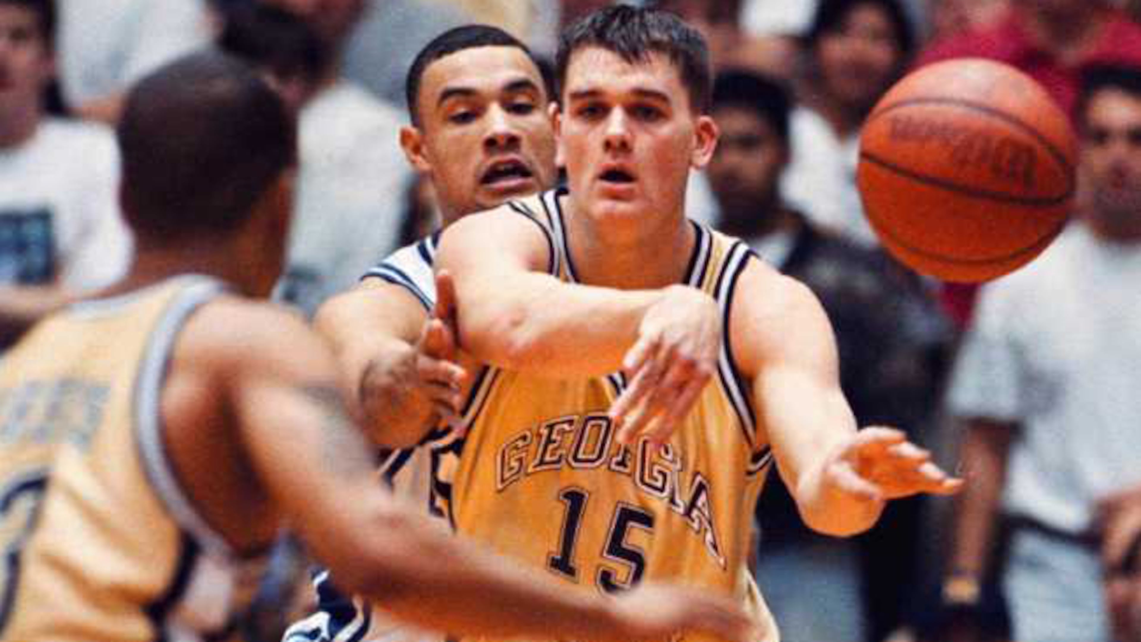 Georgia Tech's Matt Harpring (15) dishes off the ball when he is met by Duke's Trajan Langdon (21) during game action, Sunday, Feb. 2, 1997 at Cameron Indoor Stadium in Durham, N.C. Duke defeated Georgia Tech 70-61. (AP Photo/ Karl DeBlaker)