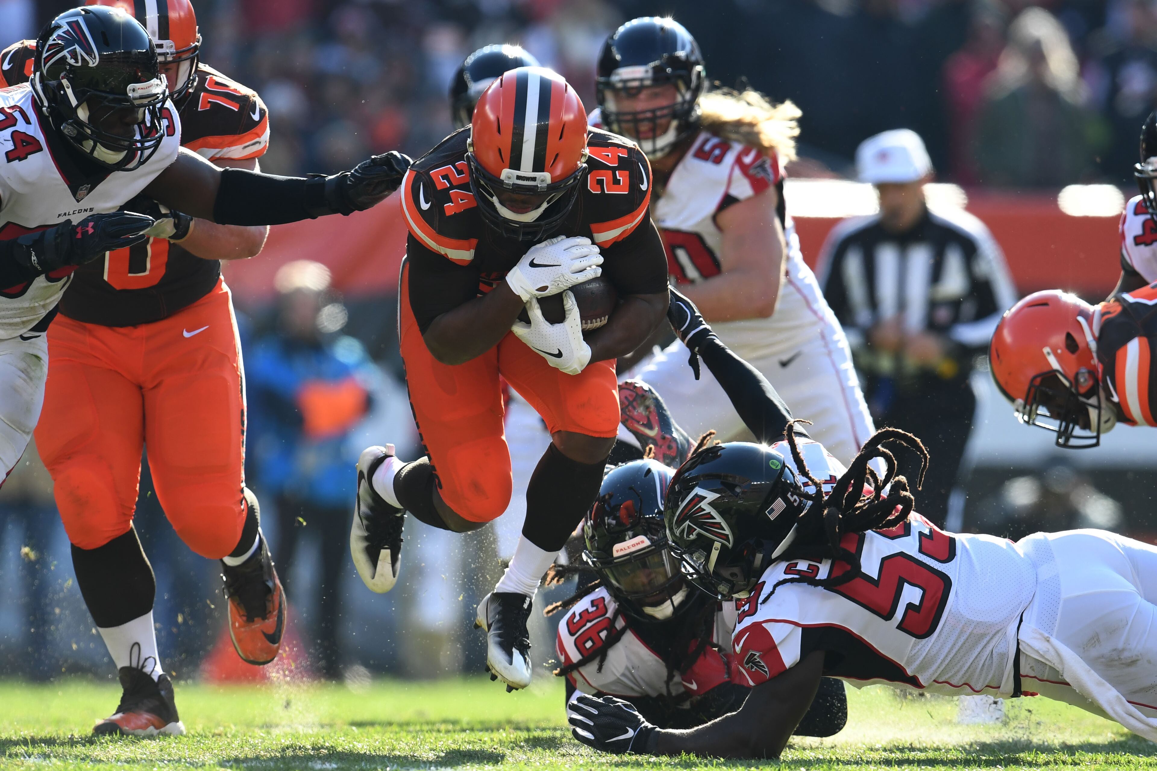 CLEVELAND, OH - NOVEMBER 11: Derrick Kindred #26 of the Cleveland Browns breaks free from a tackle from Kemal Ishmael #36 of the Atlanta Falcons in the third quarter at FirstEnergy Stadium on November 11, 2018 in Cleveland, Ohio. (Photo by Jason Miller/Getty Images)