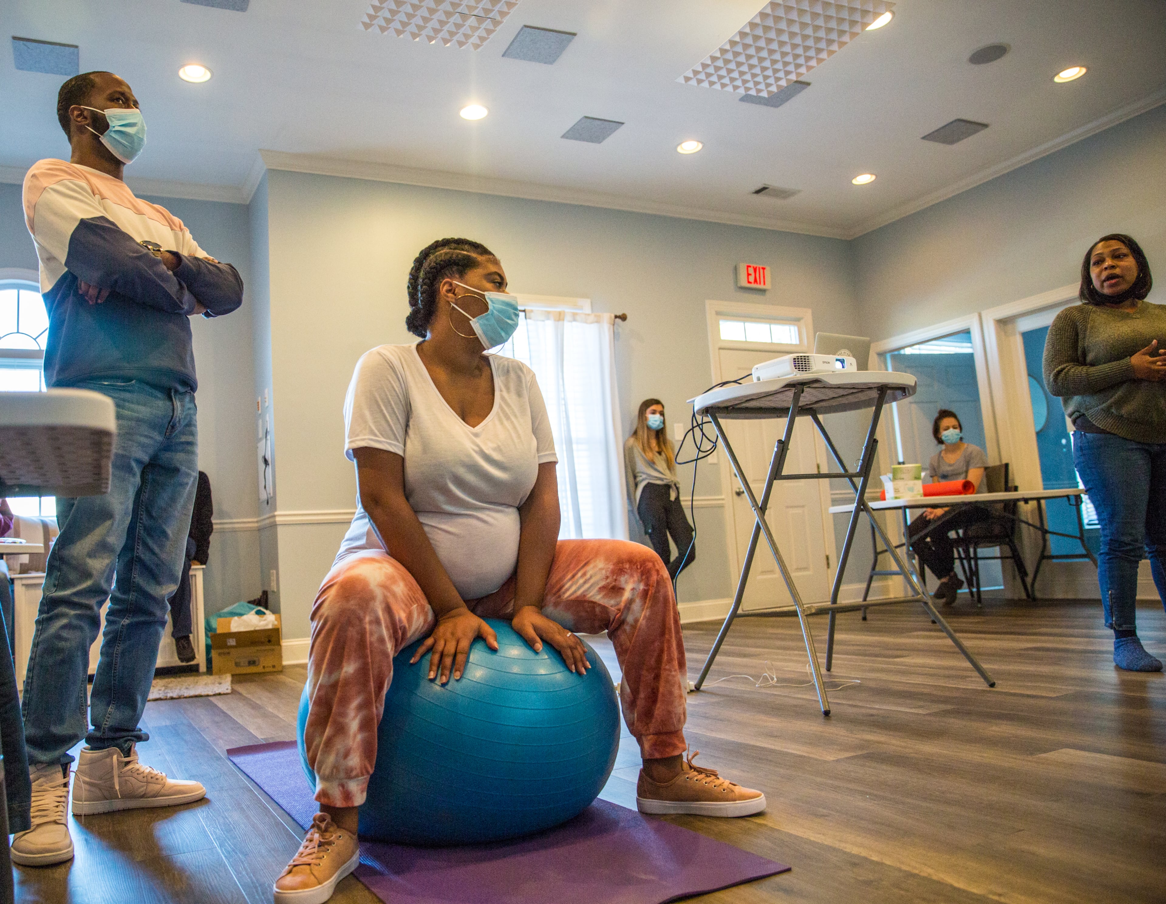 First-time parents DeMarus and Sierra Perry participate in the Birth by Grace Midwifery class in Peachtree City on a Saturday last month. (Jenni Girtman for The Atlanta Journal-Constitution)