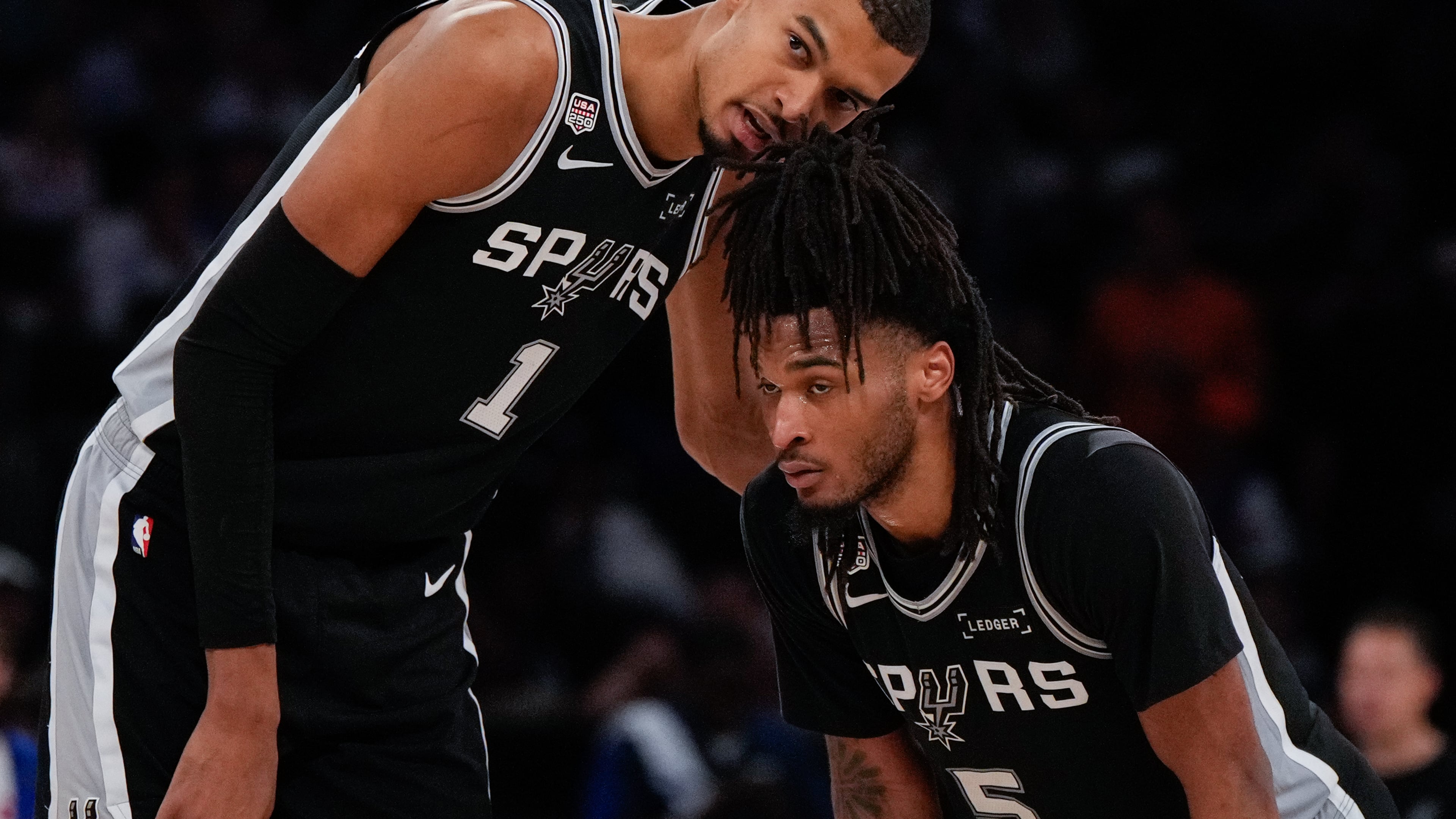 Spurs forward Victor Wembanyama (left) talks with guard Stephon Castle during the second half of Game 3 of the NBA Finals against the Knicks on Monday, June 8, 2026, in New York. (Ross D. Franklin/AP)