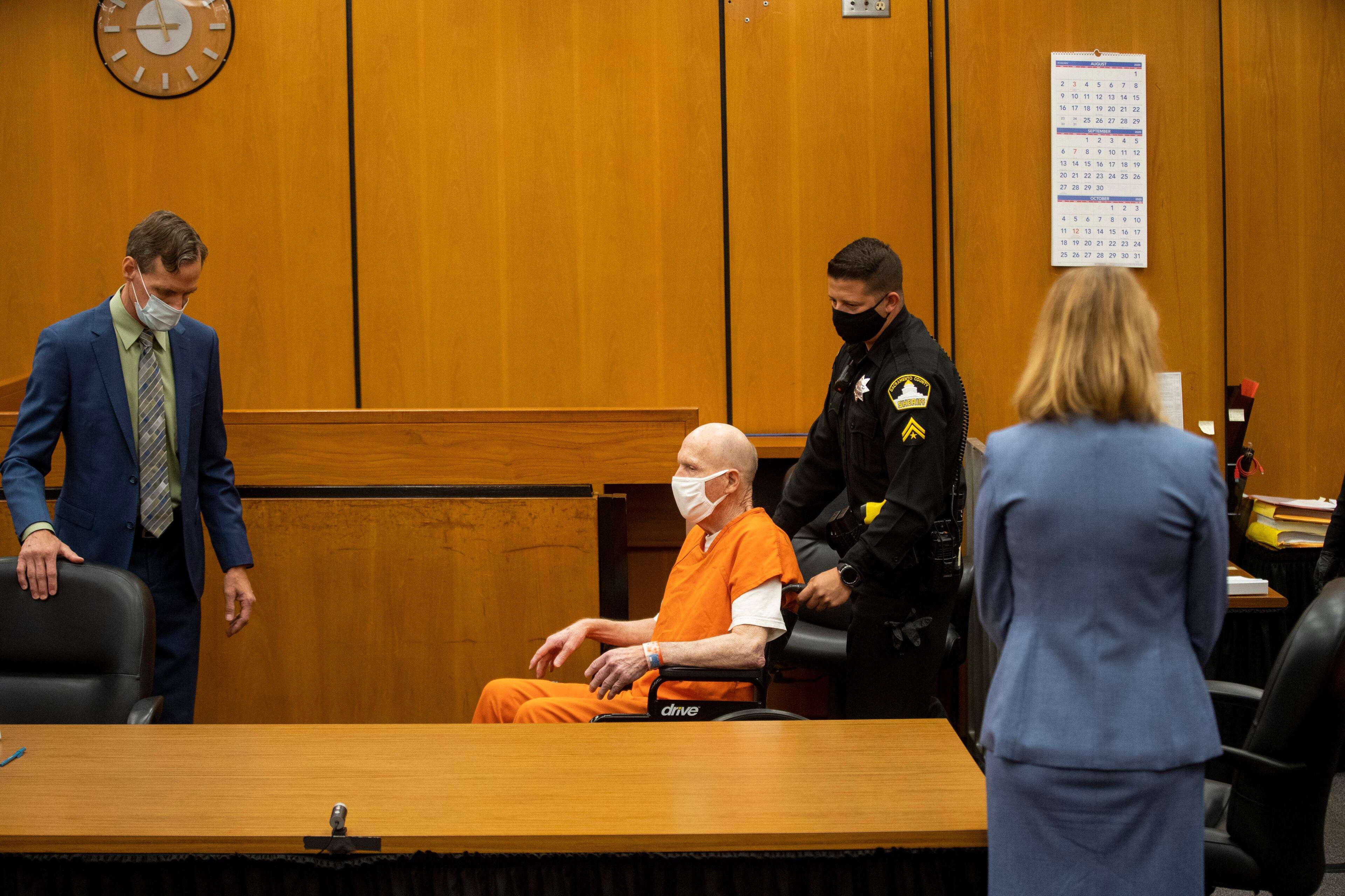 Joseph James DeAngelo is brought to the court room for the first day of victim impact statements at the Gordon D. Schaber Sacramento County Courthouse on Tuesday, Aug. 18, 2020, in Sacramento, Calif. DeAngelo is a former police officer in California who eluded capture for four decades. The scope of his crimes "is simply staggering,” prosecutors said in a court summary released Monday — 13 known murders and nearly 50 rapes between 1975 and 1986. (Santiago Mejia/San Francisco Chronicle via AP, Pool)