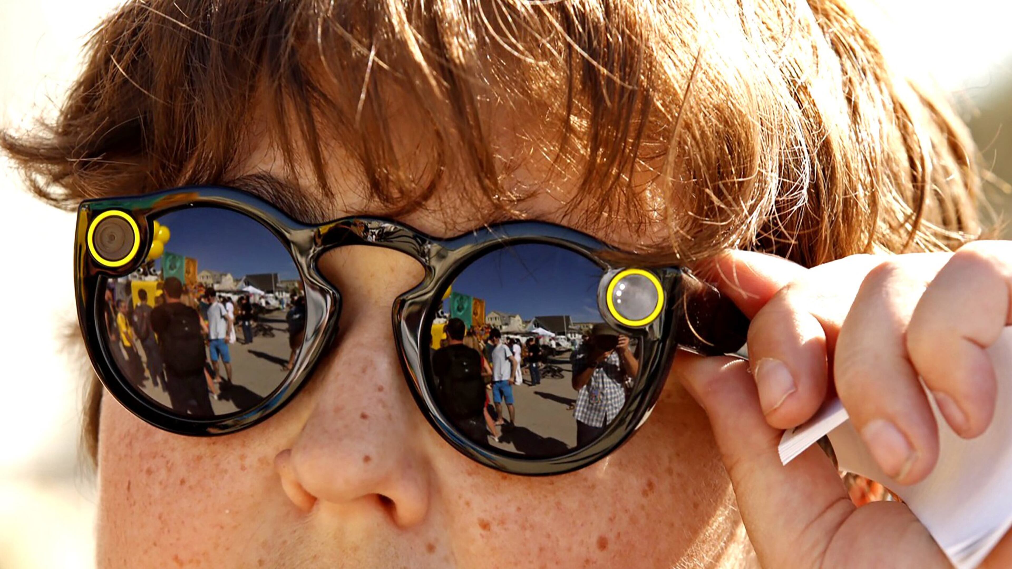 Andy Milonakis, 16, tries on Snap Spectacles on Nov. 10, the day they went on sale. (Al Seib/Los Angeles Times/TNS)
