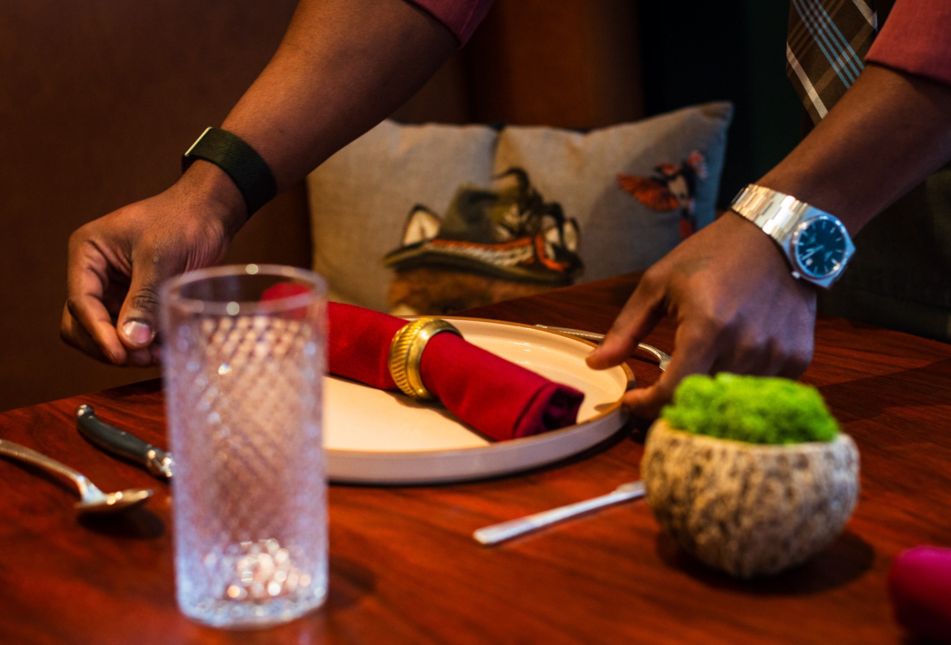 Rell Hall, 30, sets up the dining room at Nadair. Henri Hollis/AJC