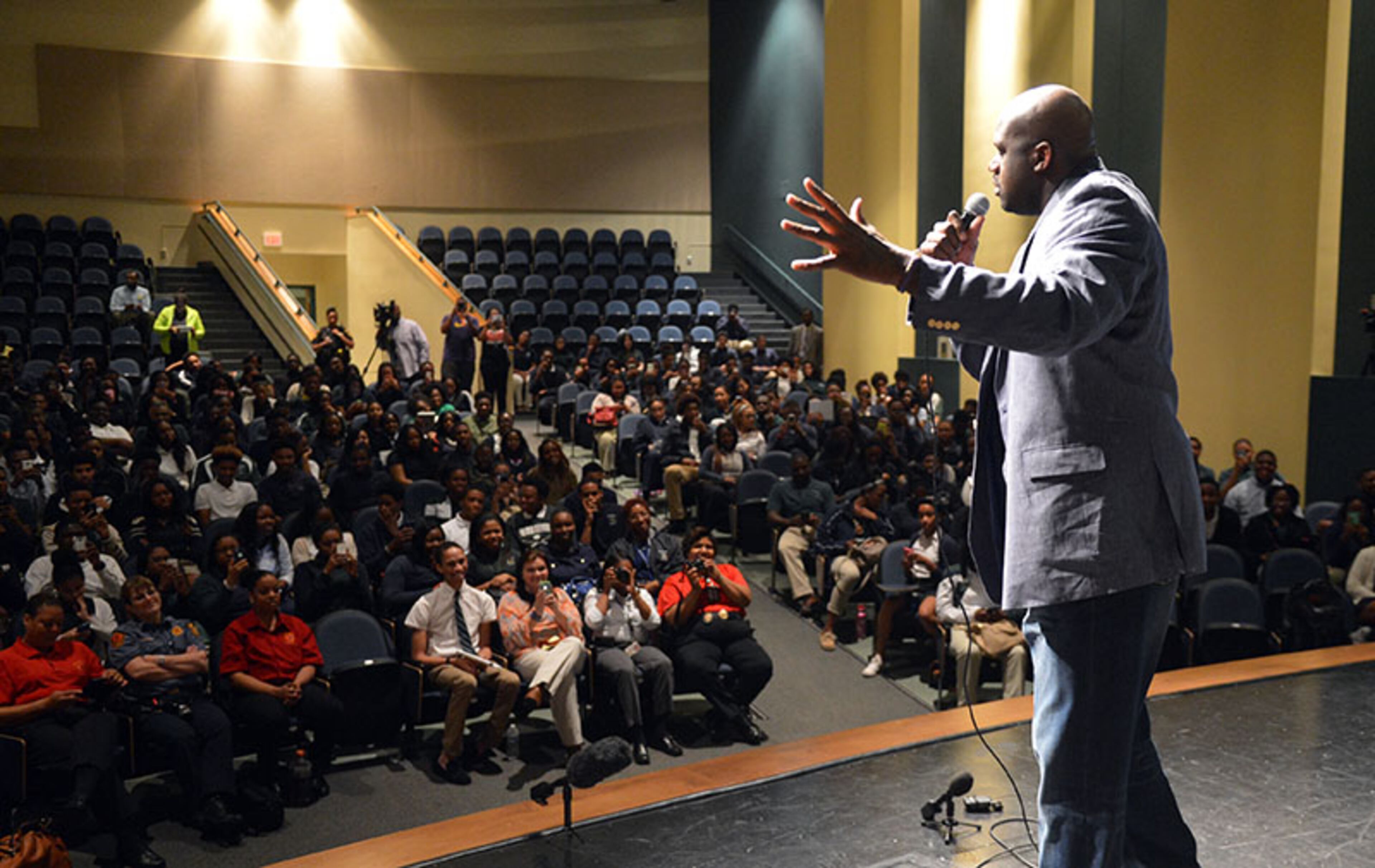 The seniors and juniors intently listen to NBA star Shaquille O'Neal speaks during the program.