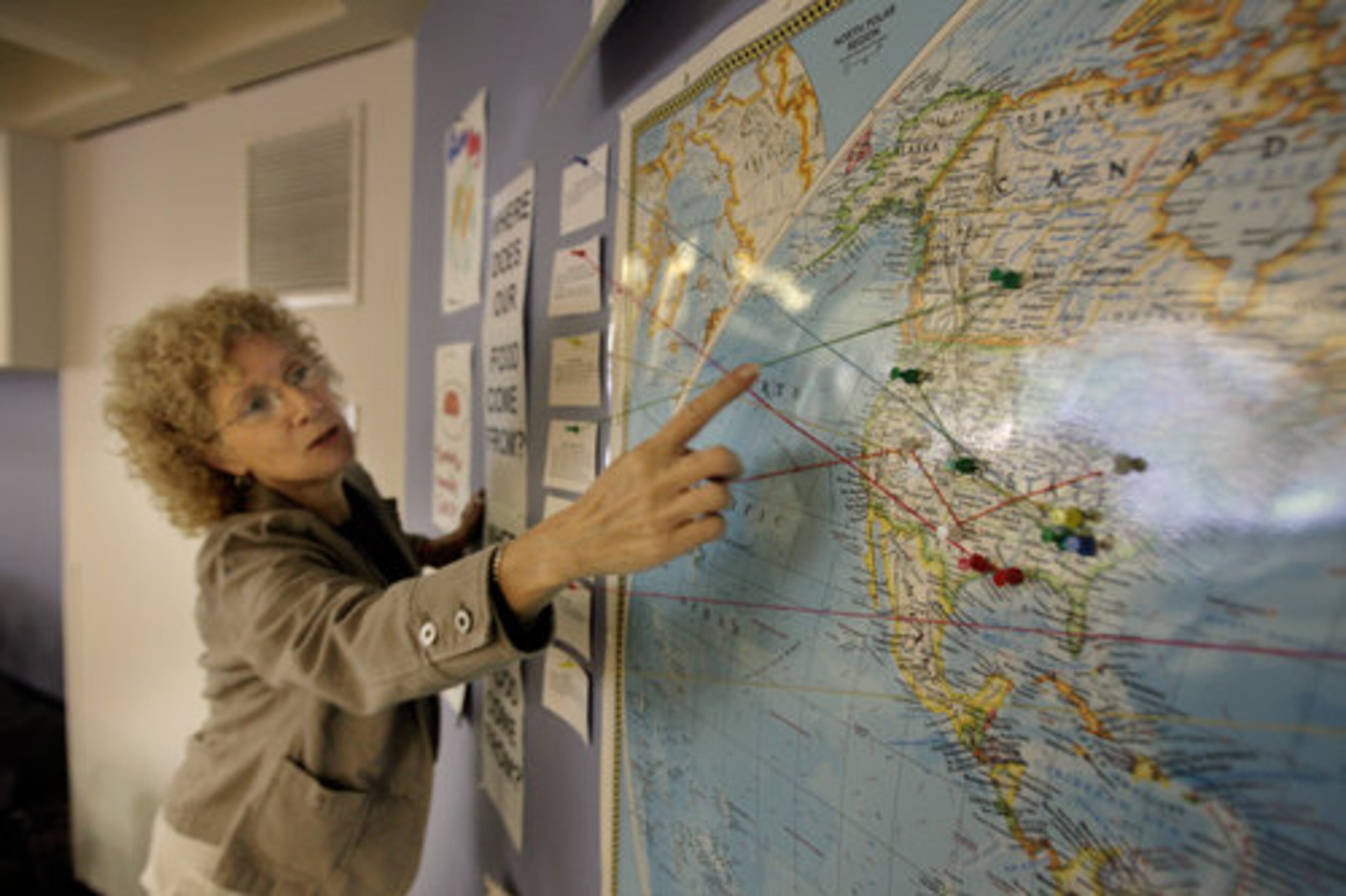 Lovett's food services director, Meredith Statler, uses a map to show where some of its food comes from. The Atlanta private school is trying to reduce its reliance on frozen fruits and vegetables as well as produce from far-away places.