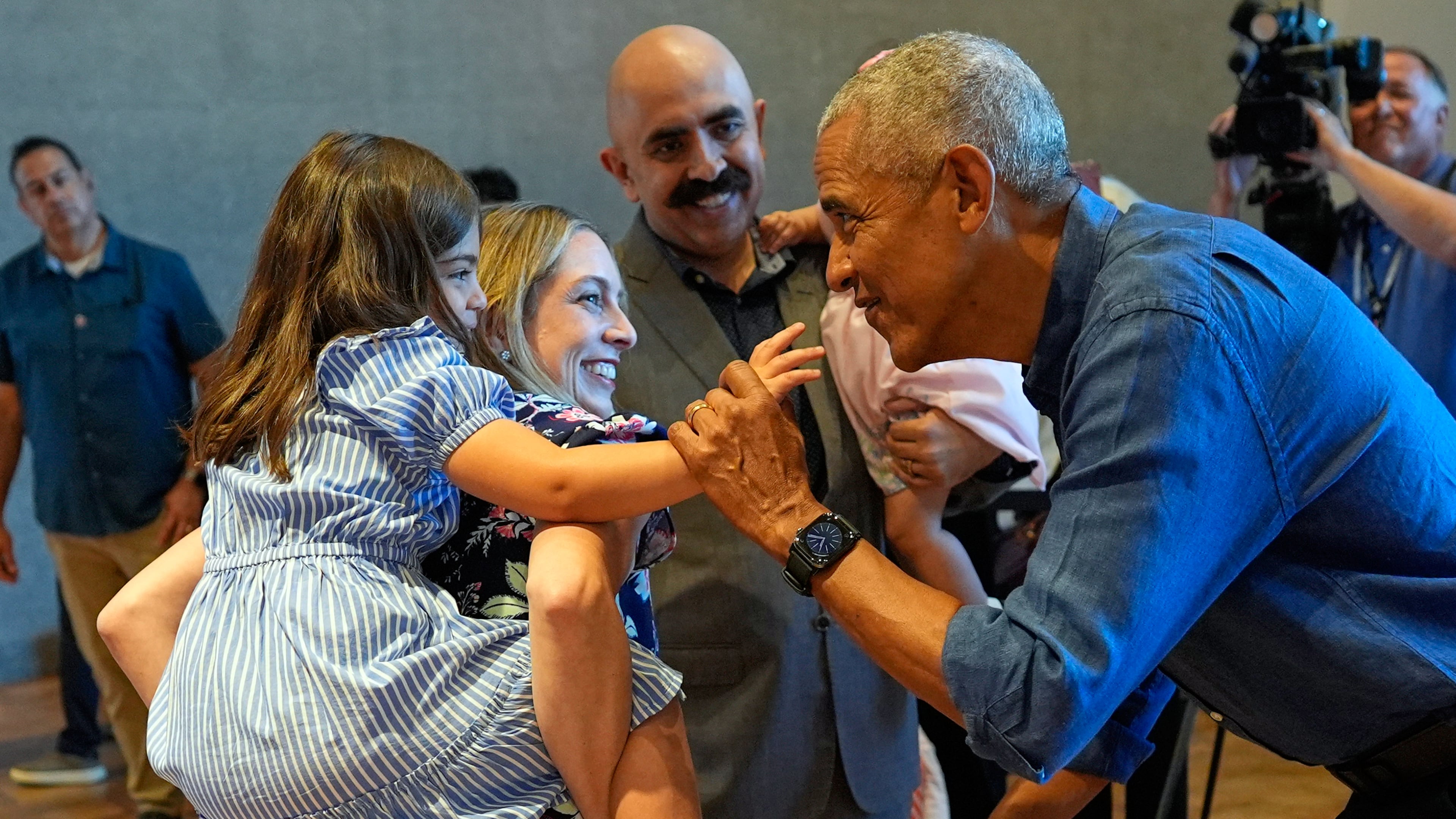 Former President Barack Obama greets the first group of visitors at the official opening of the Obama Presidential Center in Chicago, Friday, June 19, 2026. (AP Photo/Pablo Martinez Monsivais, Pool)