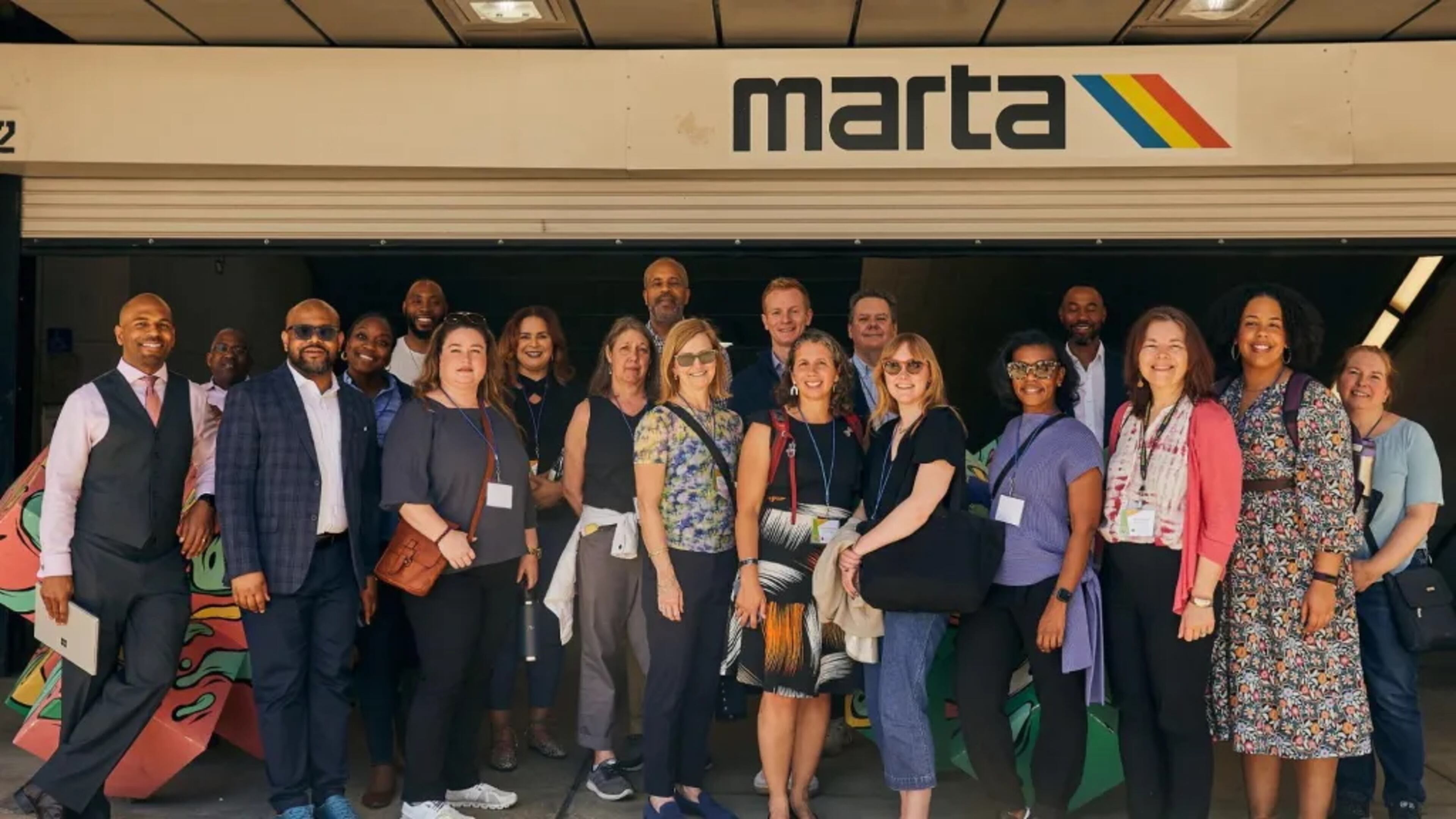 Participants in a Momentus Capital real estate development training program are shown outside the Five Points MARTA station in downtown Atlanta in September 2024.