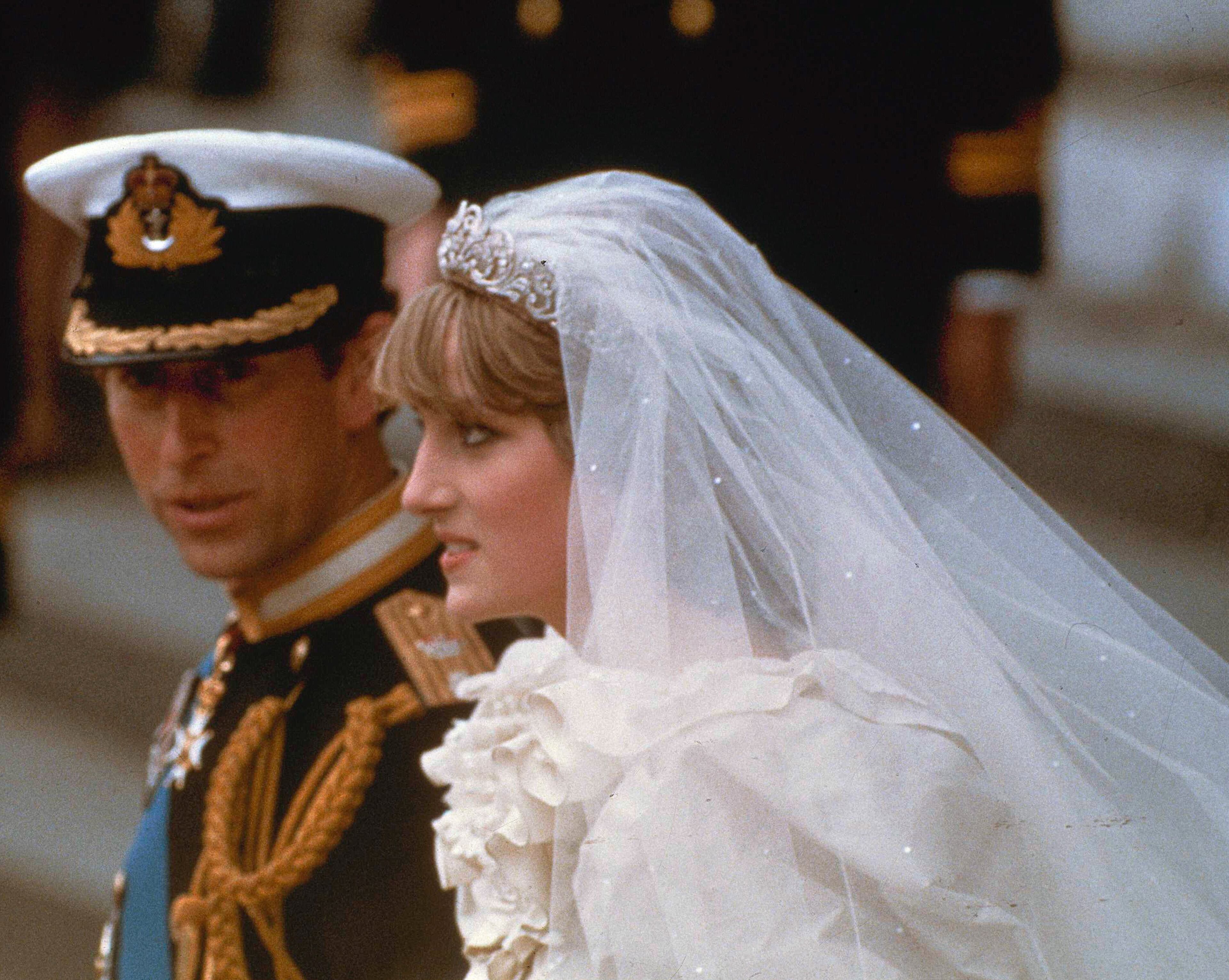 This July 29, 1981 file photo shows Prince Charles and his bride Diana, Princess of Wales, as they march down the aisle of St. Paul's Cathedral at the end of their wedding ceremony in London.