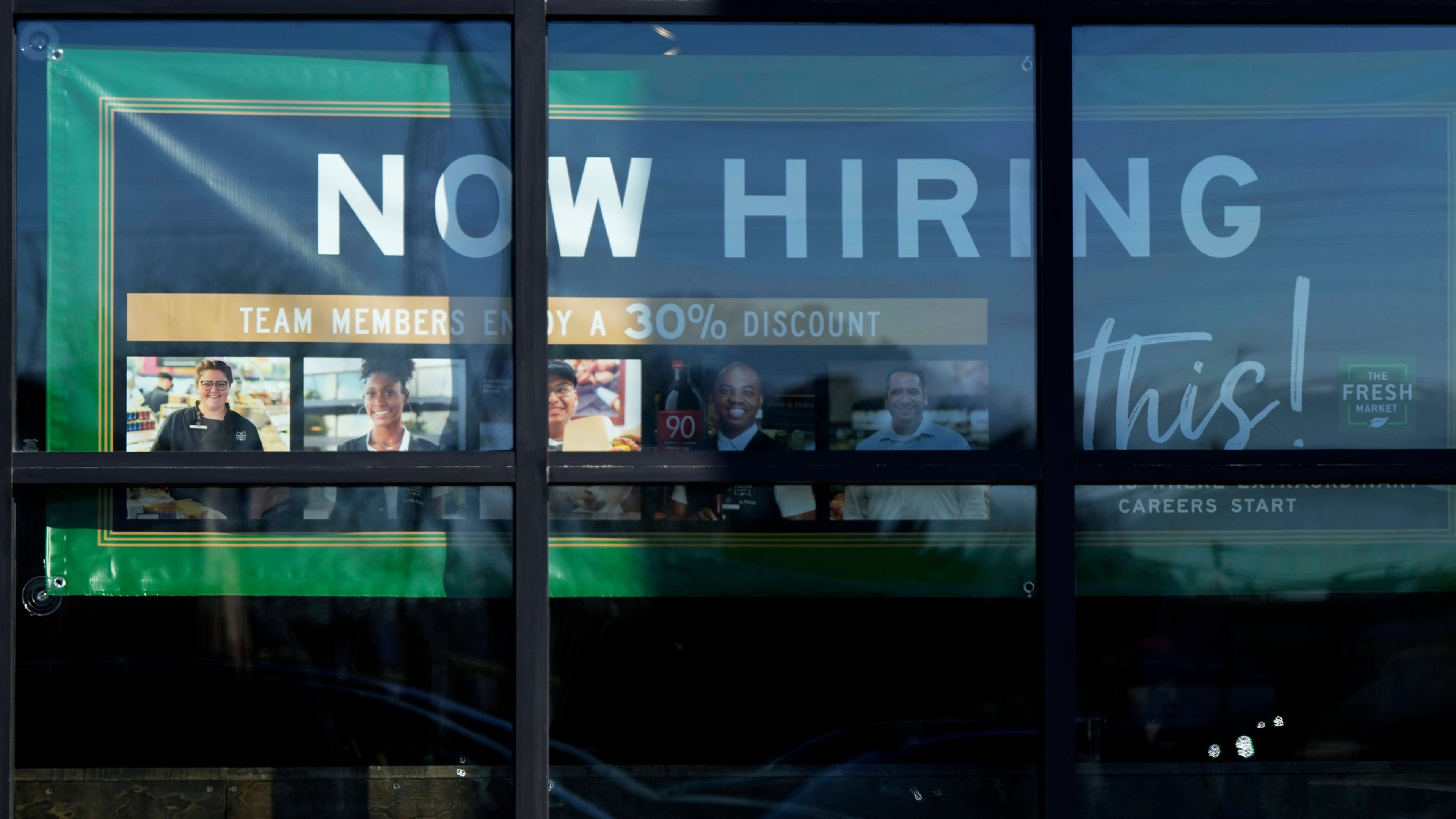 FILE - A hiring sign is displayed at a grocery store in Northbrook, Ill., Tuesday, Jan. 21, 2025. (AP Photo/Nam Y. Huh)