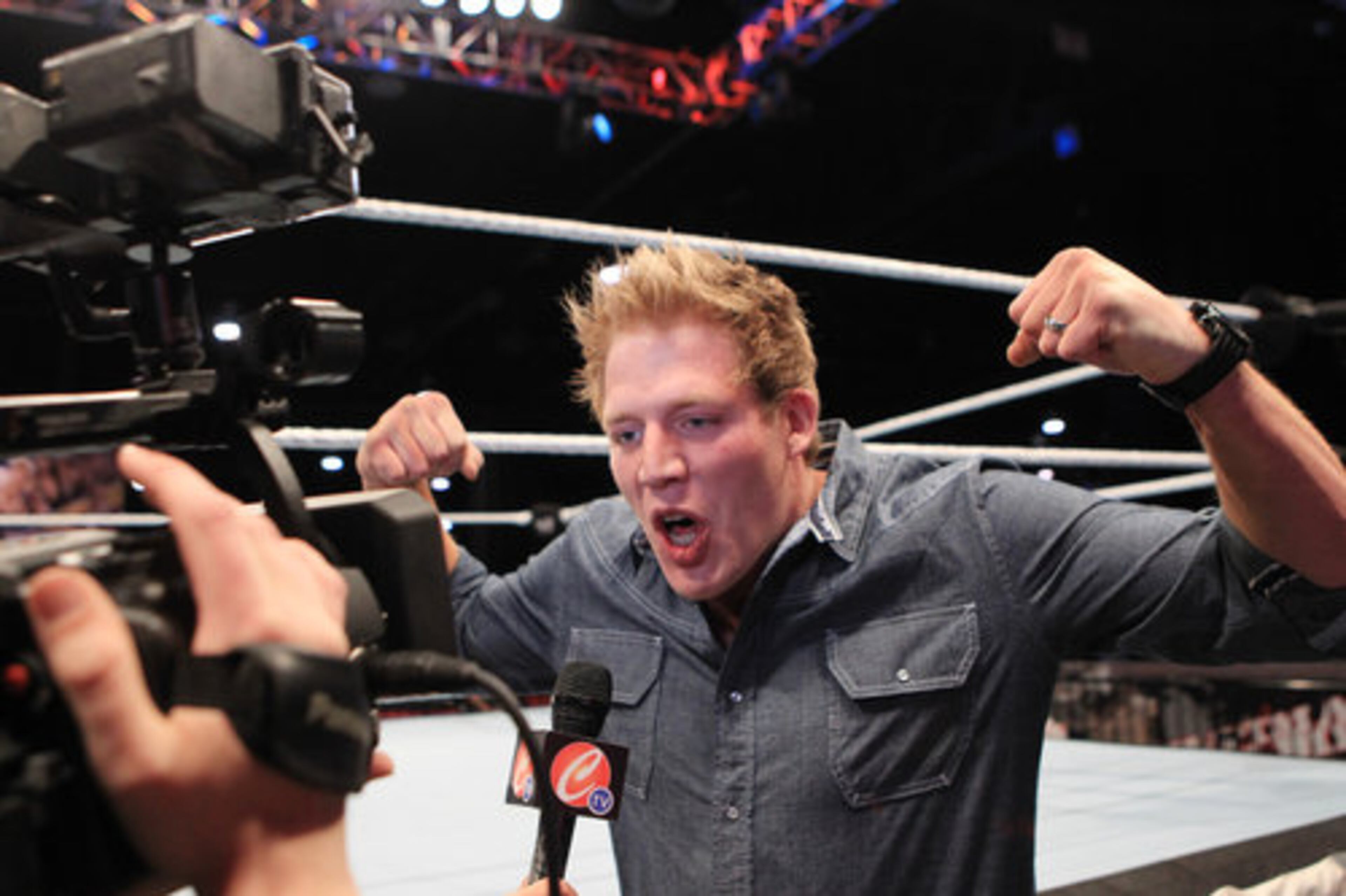 Jack Swagger flexes for the camera during a ring side interview as thousands of WWE fans from around the world attend WrestleMania Axxess, WWE's largest interactive fan experience, at the Georgia World Congress Center in Atlanta on Thursday, March 31, 2011.