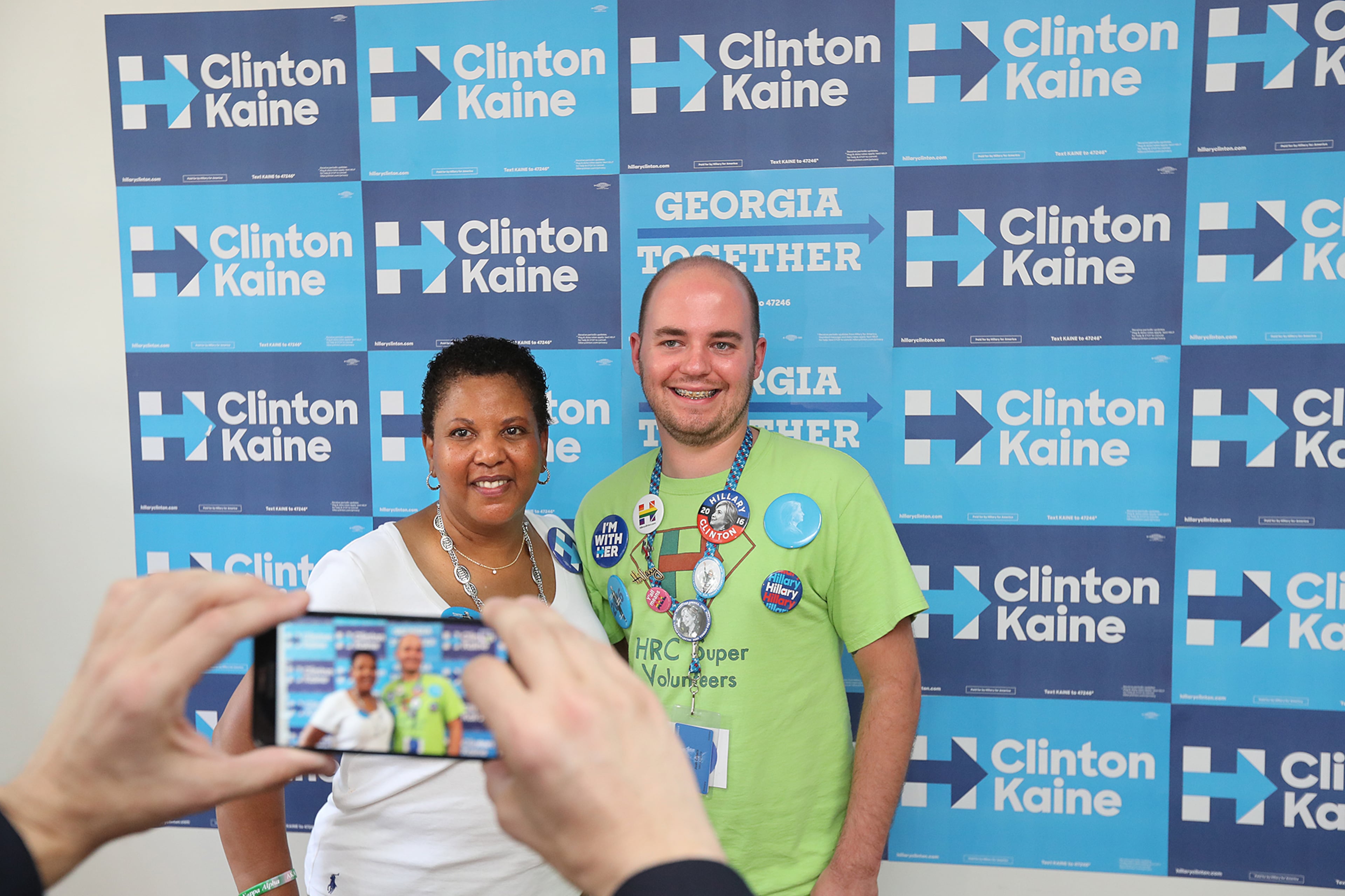 Volunteers Janet Crosby and Josh Collett have their picture taken during the opening of Democratic presidential nominee Hillary Clinton's Georgia campaign headquarters on Sunday, August 21, 2016, in Atlanta. Curtis Compton /ccompton@ajc.com