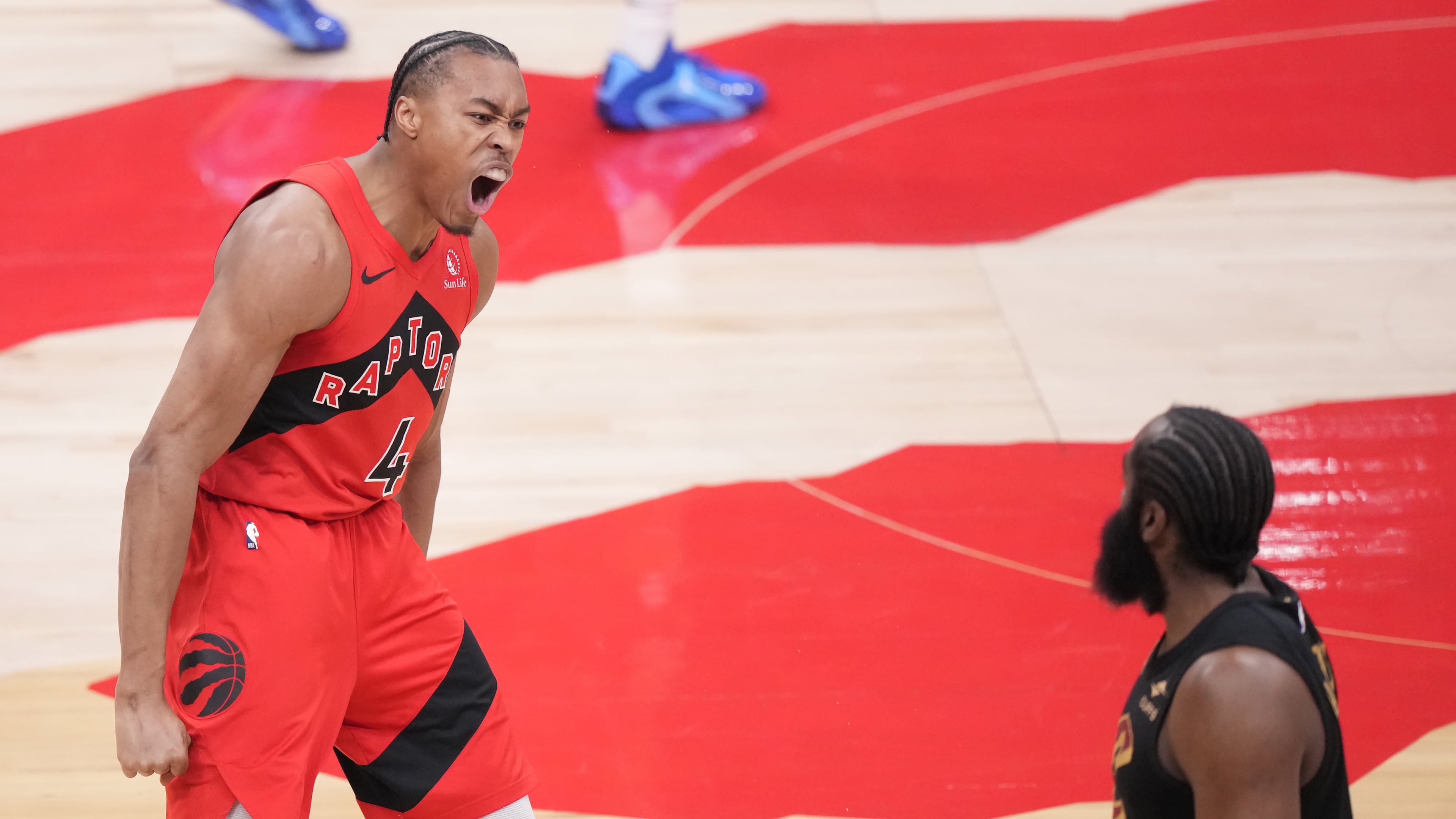 Toronto Raptors forward Scottie Barnes (4) reacts after making a basket as Cleveland Cavaliers guard James Harden (1) looks on during the first half of Game 4 in a first-round NBA basketball playoffs series in Toronto, Sunday, April 26, 2026. (Nathan Denette/The Canadian Press via AP)