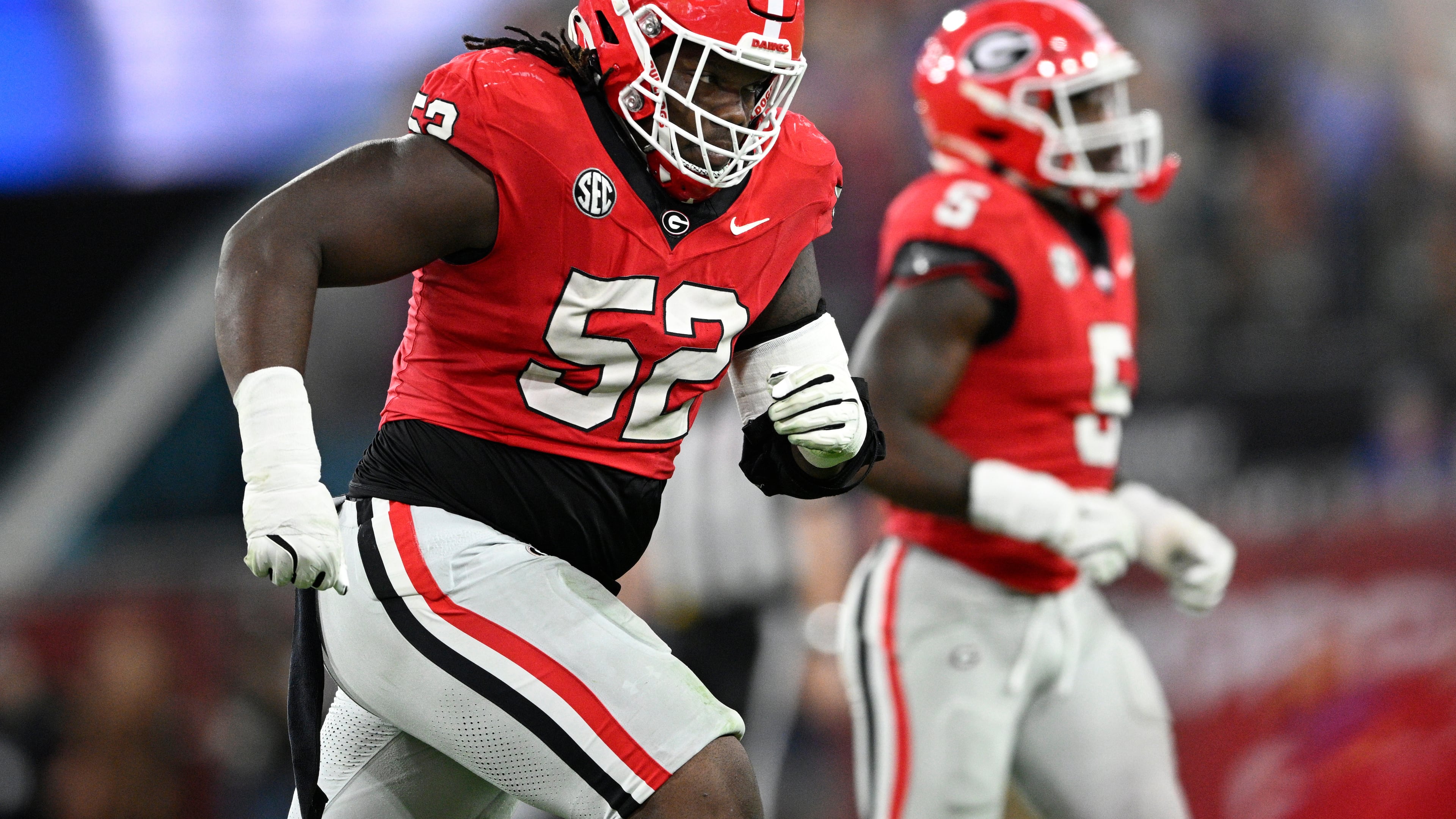 FILE - Georgia defensive lineman Christen Miller (52) heads to the sideline after a play against Florida during the second half of an NCAA college football game Saturday, Nov. 2, 2024, in Jacksonville, Fla. (AP Photo/Phelan M. Ebenhack, File)