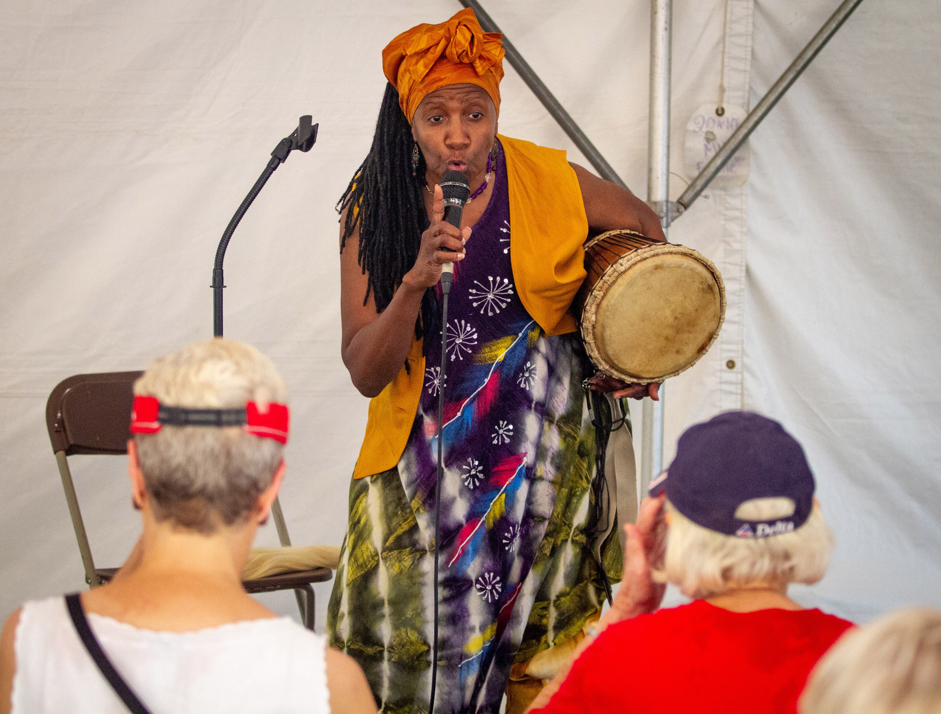 Storyteller Gwendolyn Napier entertains a small crowd during the annual Decatur Arts Festival on Sunday, May 26, 2019. STEVE SCHAEFER / SPECIAL TO THE AJC