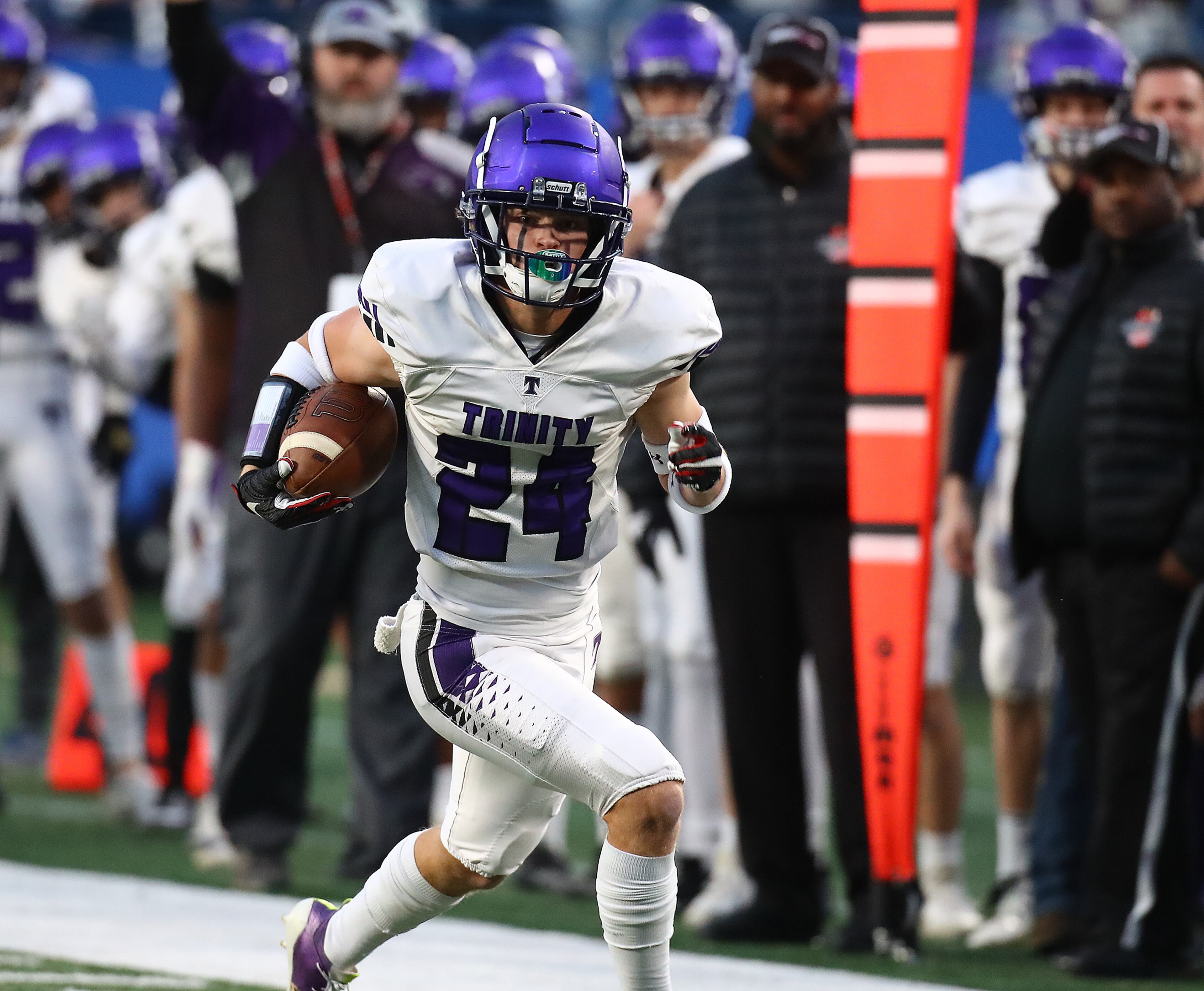 Trinity cornerback Bryce Wilcox picks off a Christian Prince Avenue Christian pass and returns it for a touchdown take a 14-0 lead during the first quarter in their GHSA Class A Private Championship game on Thursday, Dec 9, 2021, in Atlanta. “Curtis Compton / Curtis.Compton@ajc.com”`