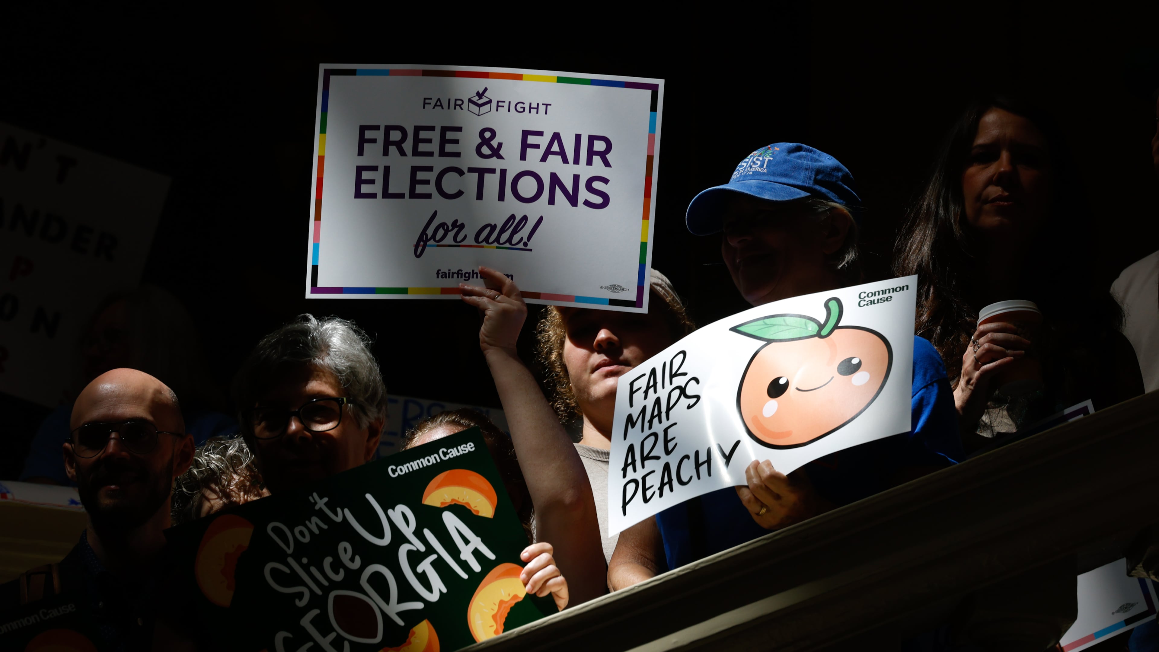 Activists opposed to redistricting, including Martha Jean Schindler, gather at a press conference before the state legislature convenes for a special session in Atlanta on June 17, 2026. Georgia Republican leaders later announced that they wouldn’t redraw the state’s political maps during the session. (Arvin Temkar/AJC)