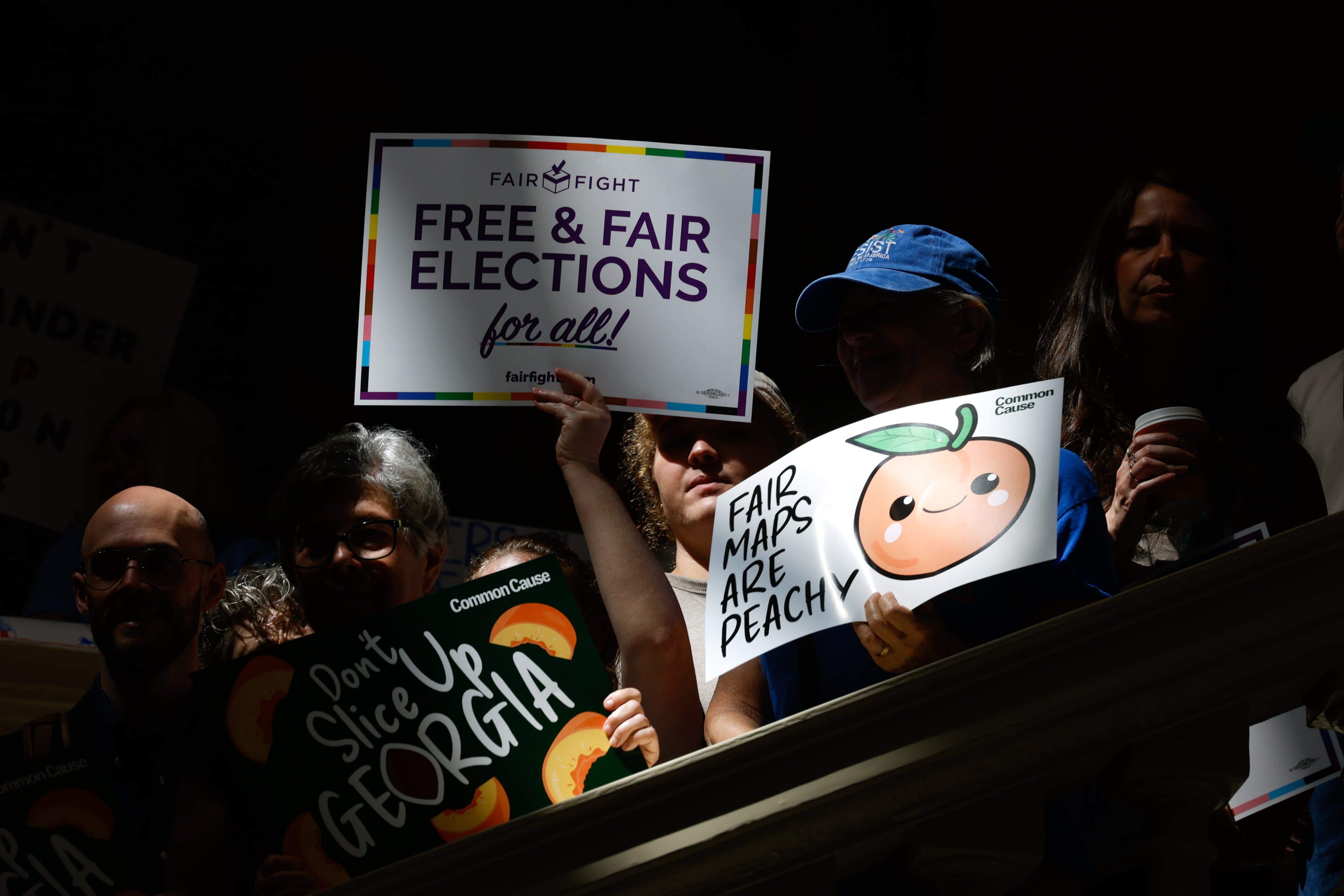 Activists opposed to redistricting, including Martha Jean Schindler, gather at a press conference before the state legislature convenes for a special session in Atlanta on June 17, 2026. Georgia Republican leaders later announced that they wouldn’t redraw the state’s political maps during the session. (Arvin Temkar/AJC)