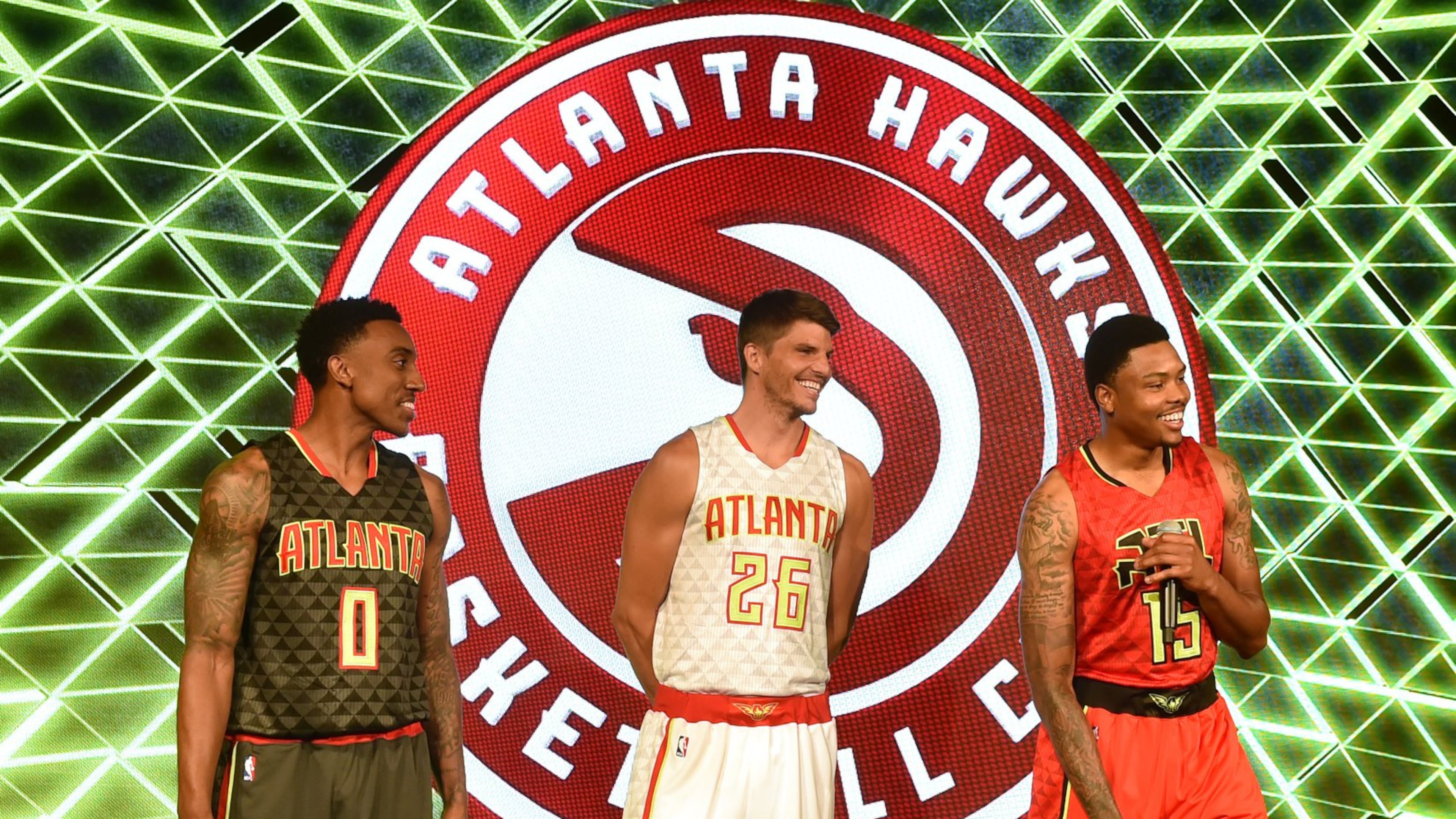The Atlanta Hawks unveil their new uniforms at a press conference Wednesday at Philips Arena. The road uniform is on the left, the home uniform in the center and the alternate road uniform on the right. (Brant Sanderlin/bsanderlin@ajc.com)